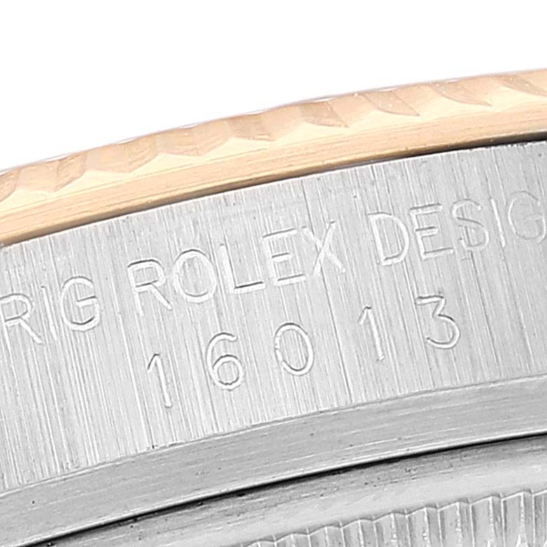 This image shows a close-up of the engraved serial number area on the side of a Rolex Vintage Collection 16013 Men's Steel and Gold (two tone) Black Dial 16013 Men's Steel and Gold (two tone) Black Dial model.