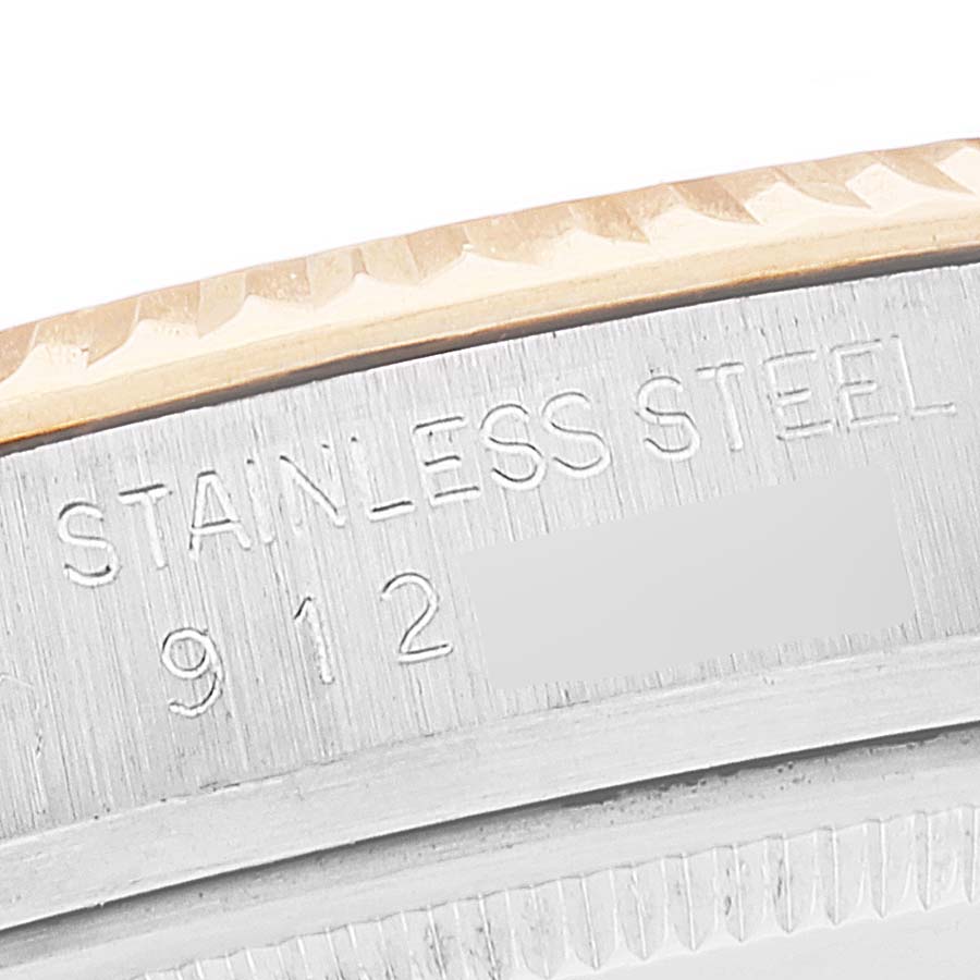 The image shows a close-up view of the Stainless Steel rim and serial number of the Rolex Vintage Collection 16013 Men's Steel and Gold (two tone) Black Dial 16013 Men's Steel and Gold (two tone) Black Dial watch.