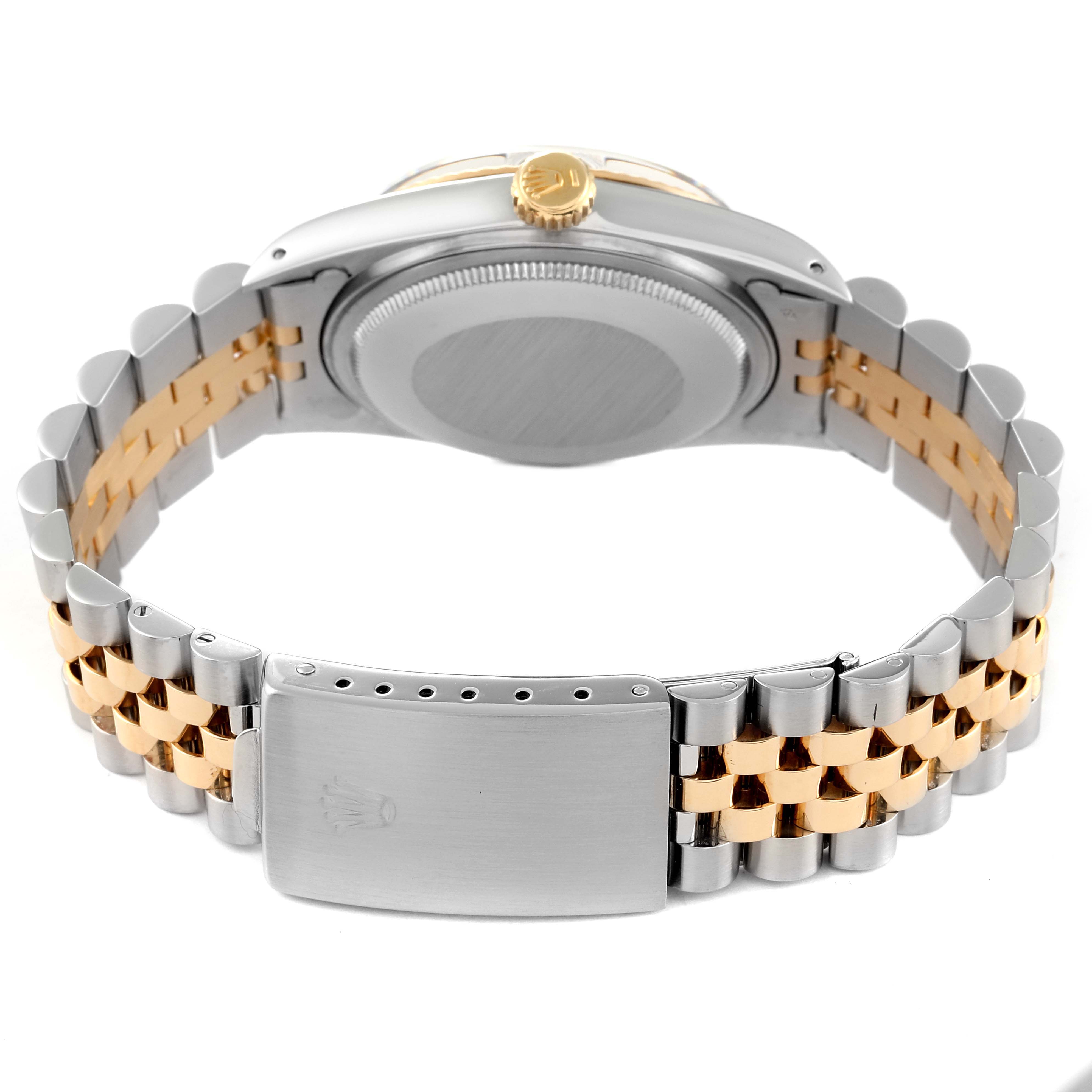 The image shows the back side of the Rolex Vintage Collection 16013 Men's Steel and Gold (two tone) Black Dial 16013 Men's Steel and Gold (two tone) Black Dial watch with its gold and silver metal bracelet and clasp visible.