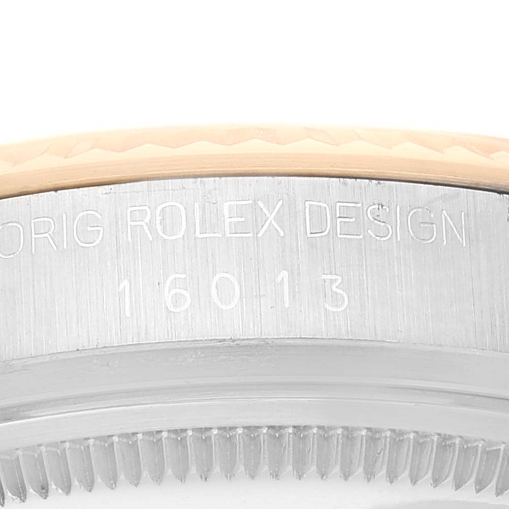 The image shows a close-up of the side view of the bezel and case of a Vintage Collection Rolex watch.