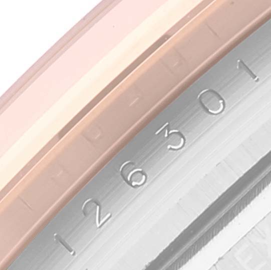This is a close-up view of the serial number engraving on the case of the Rolex Datejust 41 126301 Men's Steel and Gold (two tone) Grey Dial 126301 Men's Steel and Gold (two tone) Grey Dial model.
