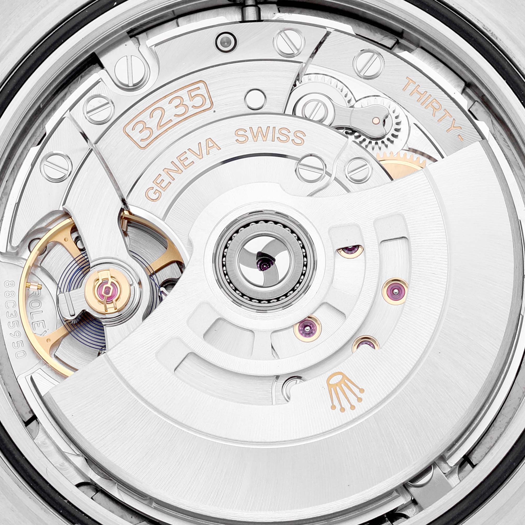 Close-up of the inner movement (caliber 3235) of a Rolex Datejust 41 126301 Men's Steel and Gold (two tone) Grey Dial 126301 Men's Steel and Gold (two tone) Grey Dial, showcasing mechanical components and Geneva inscriptions.