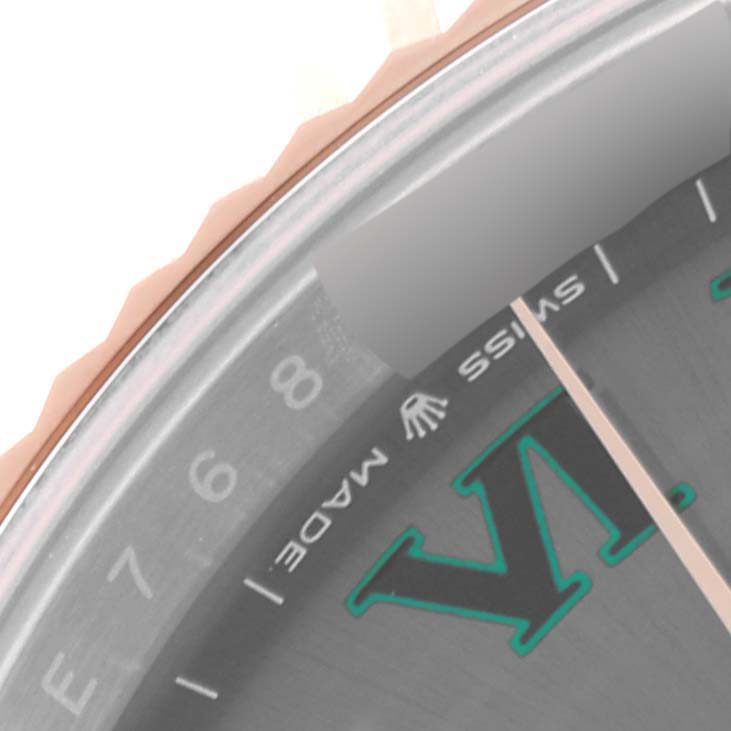 This close-up image of the Rolex Datejust 41 126331 Men's Steel and Gold (two tone) Grey Dial 126331 Men's Steel and Gold (two tone) Grey Dial model showcases the dial and a portion of the bezel.