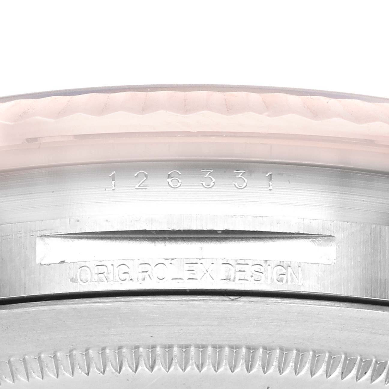 The image shows a close-up of the engravings on the case back edge of a Rolex Datejust 41 126331 Men's Steel and Gold (two tone) Grey Dial 126331 Men's Steel and Gold (two tone) Grey Dial model watch.