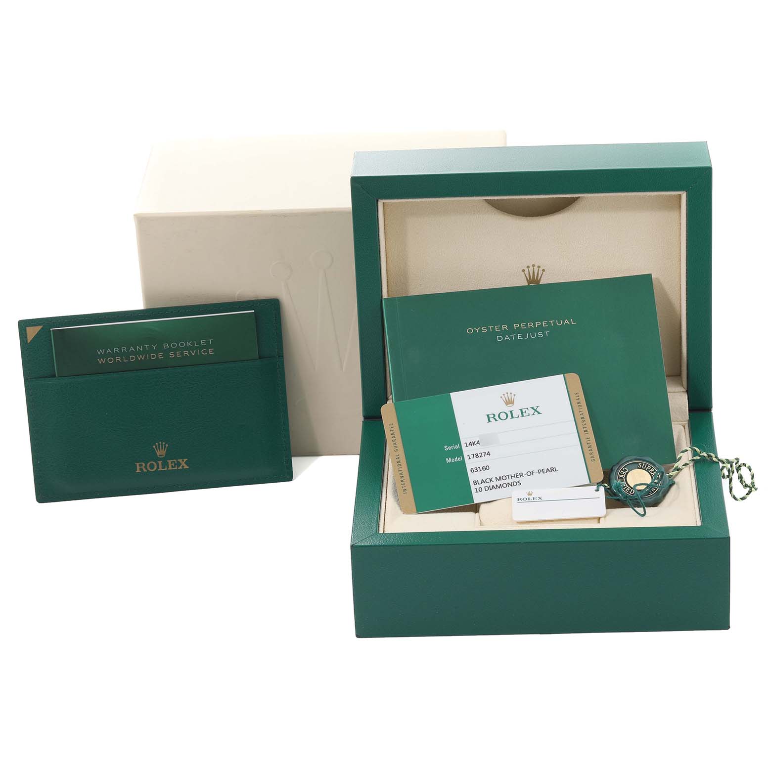 The image shows the box, warranty booklet, certificate, and accessories for a Mid-Size Rolex watch.