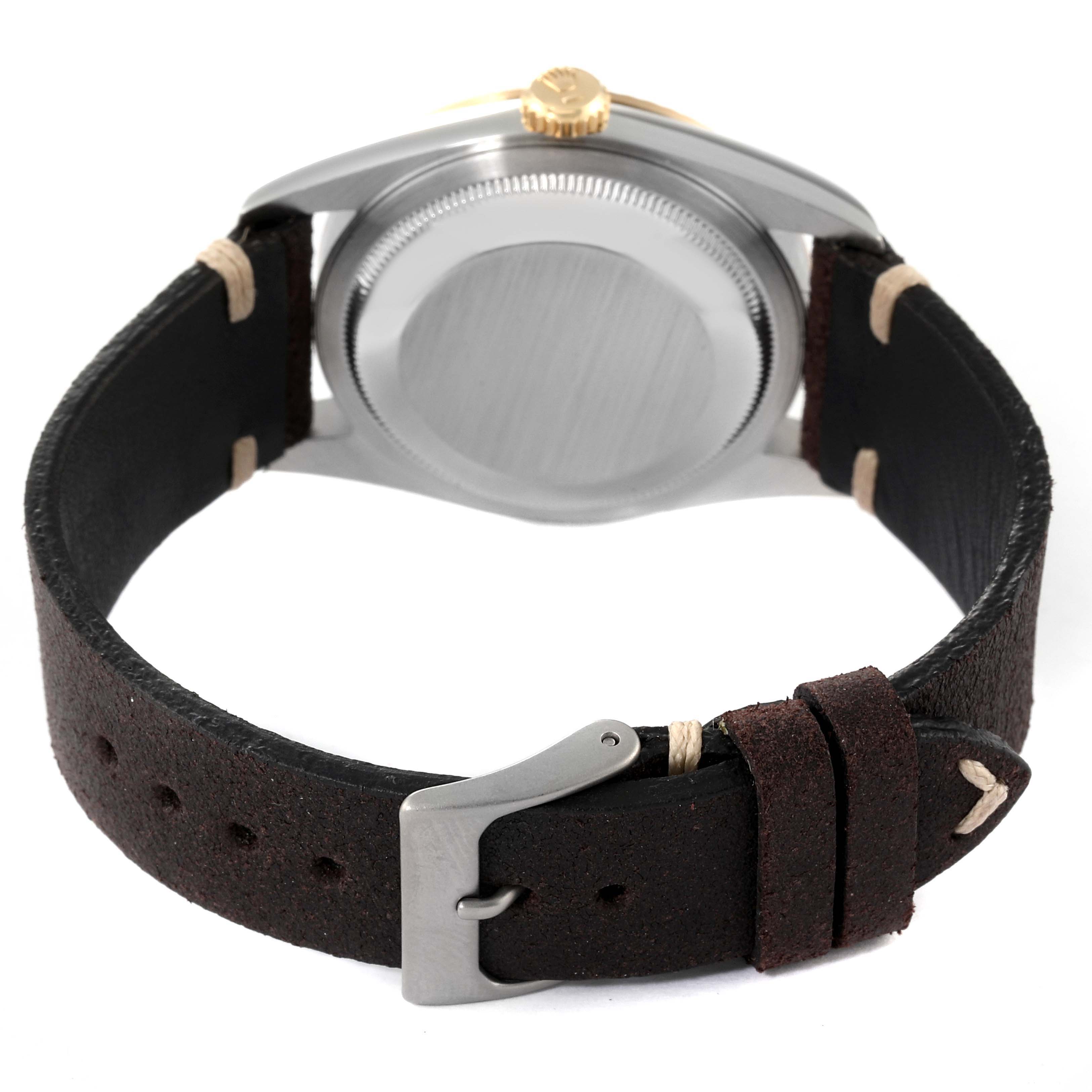 The image shows the back case and leather strap of a Rolex Datejust 16233 Men's Steel and Gold (two tone) Silver Dial 16233 Men's Steel and Gold (two tone) Silver Dial watch from a rear angle.