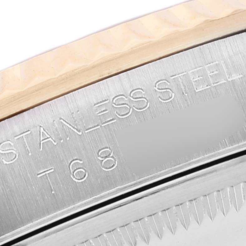 The image shows a close-up angle of the stainless steel caseback engraved with text on a Rolex Datejust 16233 Men's Steel and Gold (two tone) Silver Dial 16233 Men's Steel and Gold (two tone) Silver Dial watch.