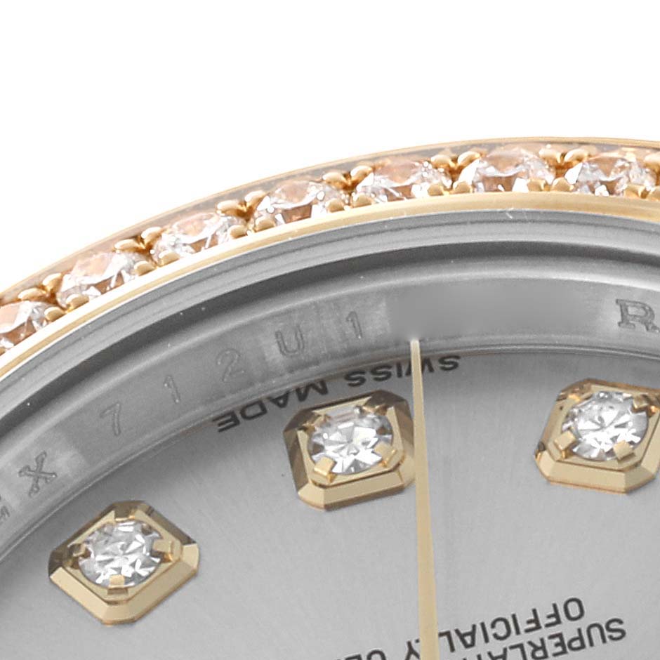 This image shows a close-up of the bezel and dial of a Rolex Datejust 179383 Women's Steel and Gold (two tone) Silver Dial 179383 Women's Steel and Gold (two tone) Silver Dial watch, highlighting the diamond markers and serial numbers.