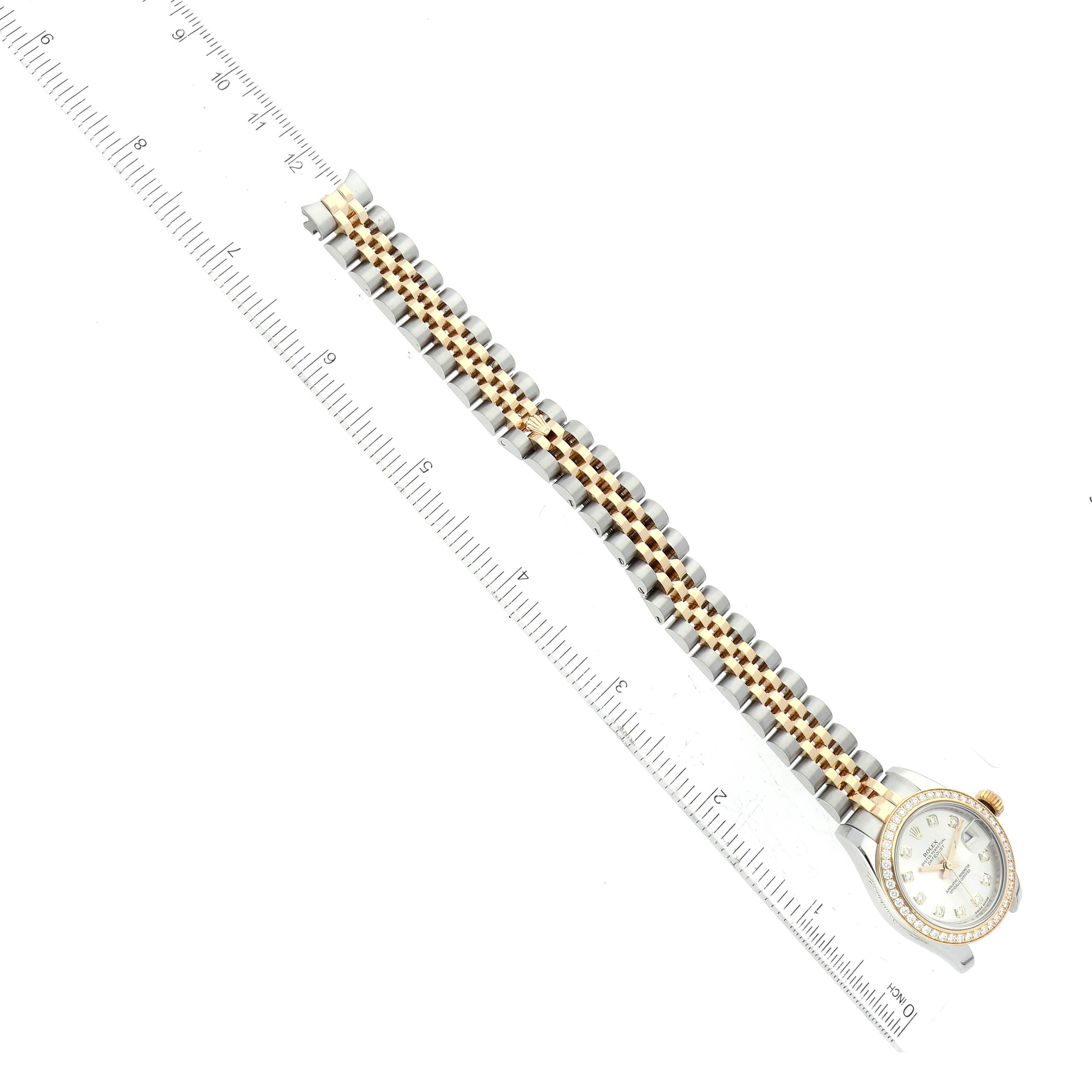 The image shows a Rolex Datejust 179383 Women's Steel and Gold (two tone) Silver Dial 179383 Women's Steel and Gold (two tone) Silver Dial watch from an overhead angle, displaying the entire bracelet and dial next to a ruler.