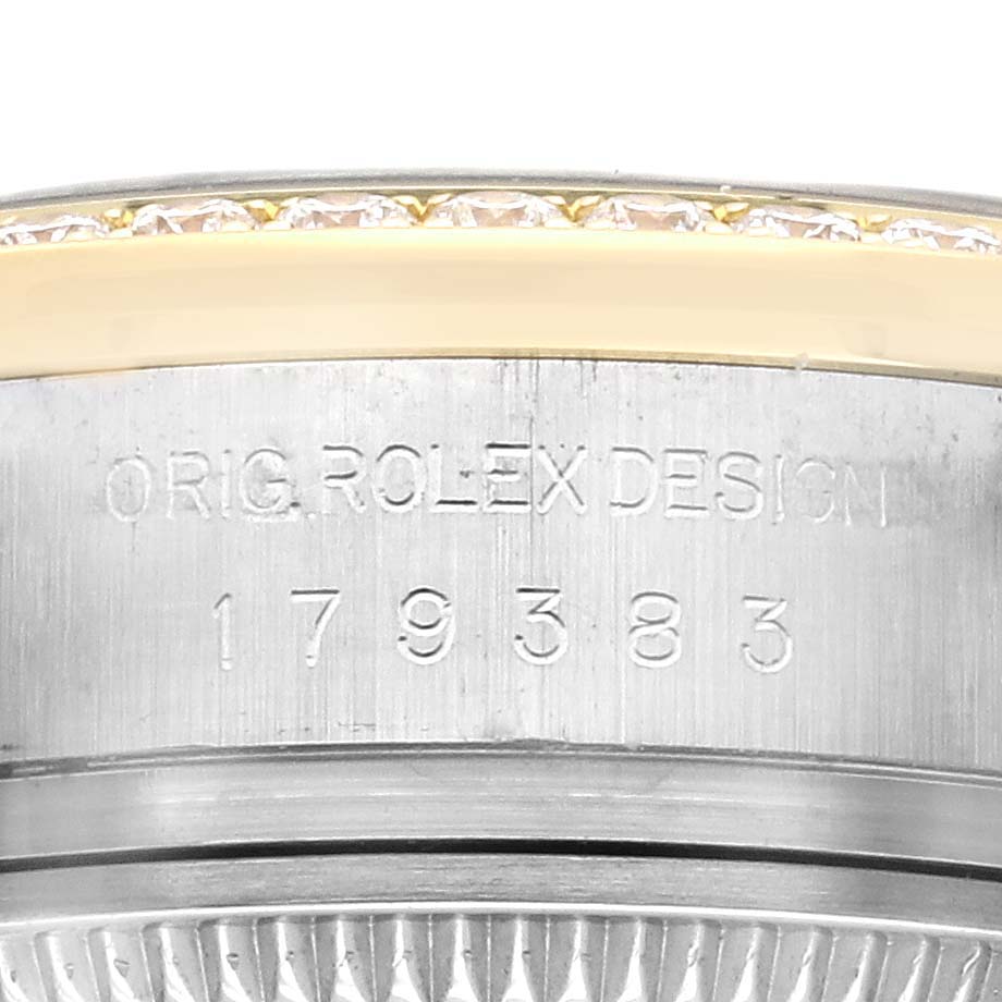 The image shows a close-up of the engraved side of the Rolex Datejust 179383 Women's Steel and Gold (two tone) Silver Dial 179383 Women's Steel and Gold (two tone) Silver Dial watch bezel.