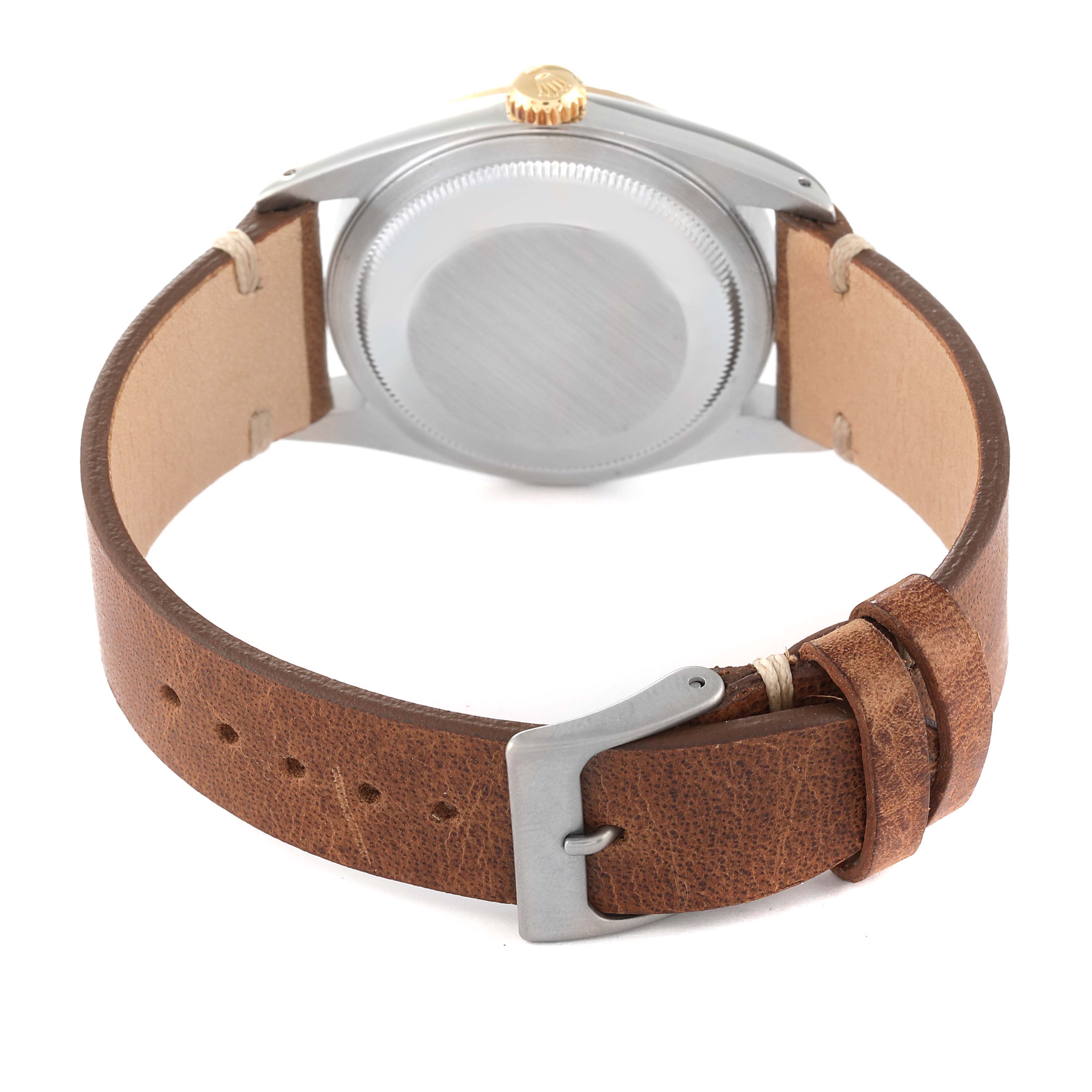 The image shows the back case and leather strap with buckle of a Rolex Datejust 16233 Men's Steel and Gold (two tone) White Dial 16233 Men's Steel and Gold (two tone) White Dial watch.