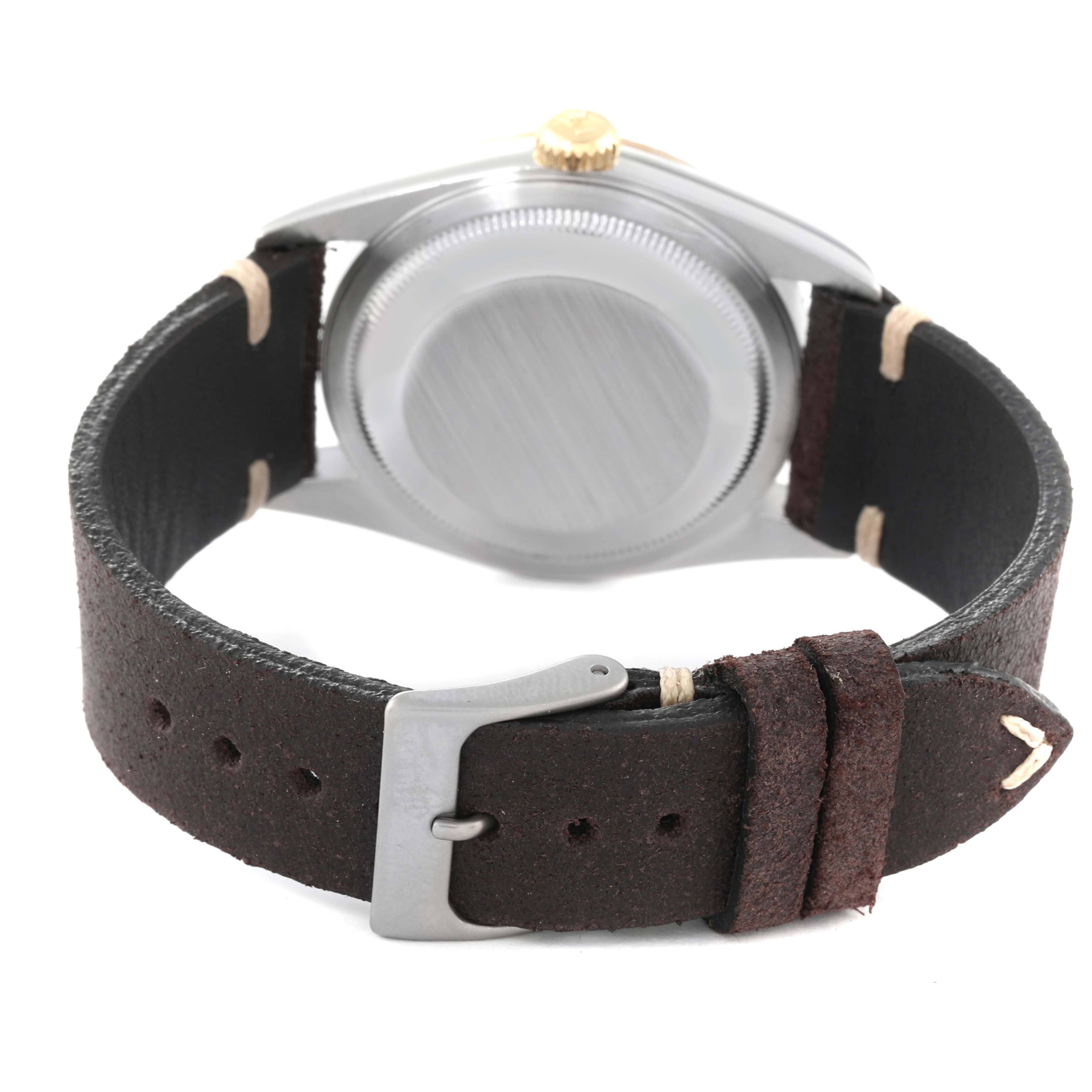 The image shows the back case and leather strap with a buckle of a Rolex Datejust 16233 Men's Steel and Gold (two tone) White Dial 16233 Men's Steel and Gold (two tone) White Dial watch.