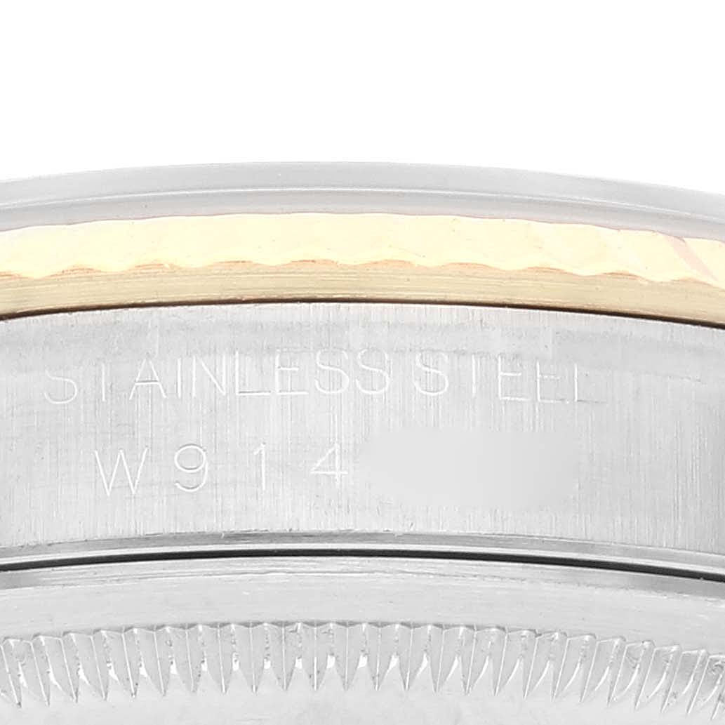 This image shows a close-up of the side case and bezel of a Rolex Datejust 16233 Men's Steel and Gold (two tone) White Dial 16233 Men's Steel and Gold (two tone) White Dial watch, highlighting the stainless steel material and model details.