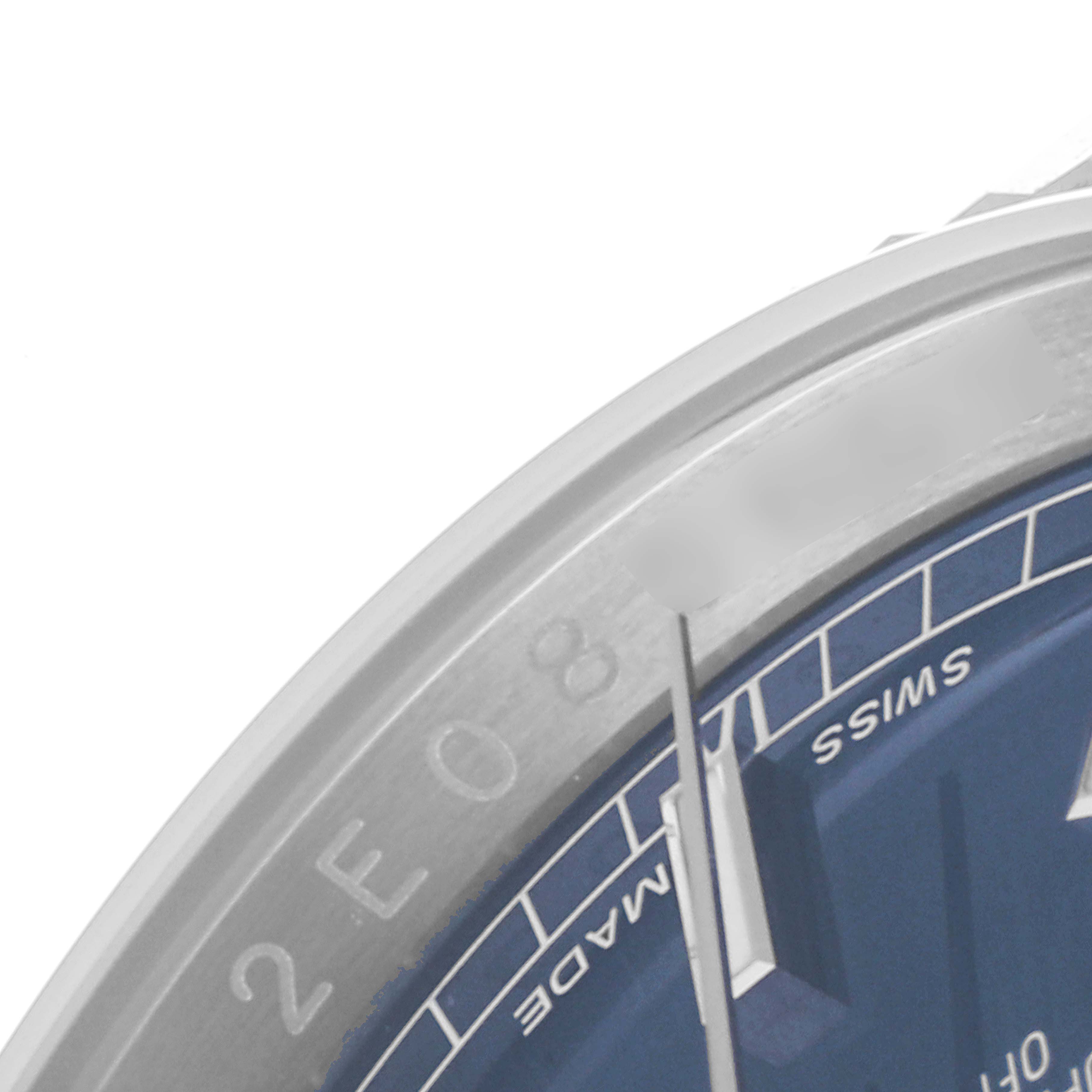 This is a close-up angle of the bezel and dial of a Rolex Datejust 116234 Men's Stainless Steel Blue Dial 116234 Men's Stainless Steel Blue Dial watch, focusing on the minute markers and "Swiss Made" text.