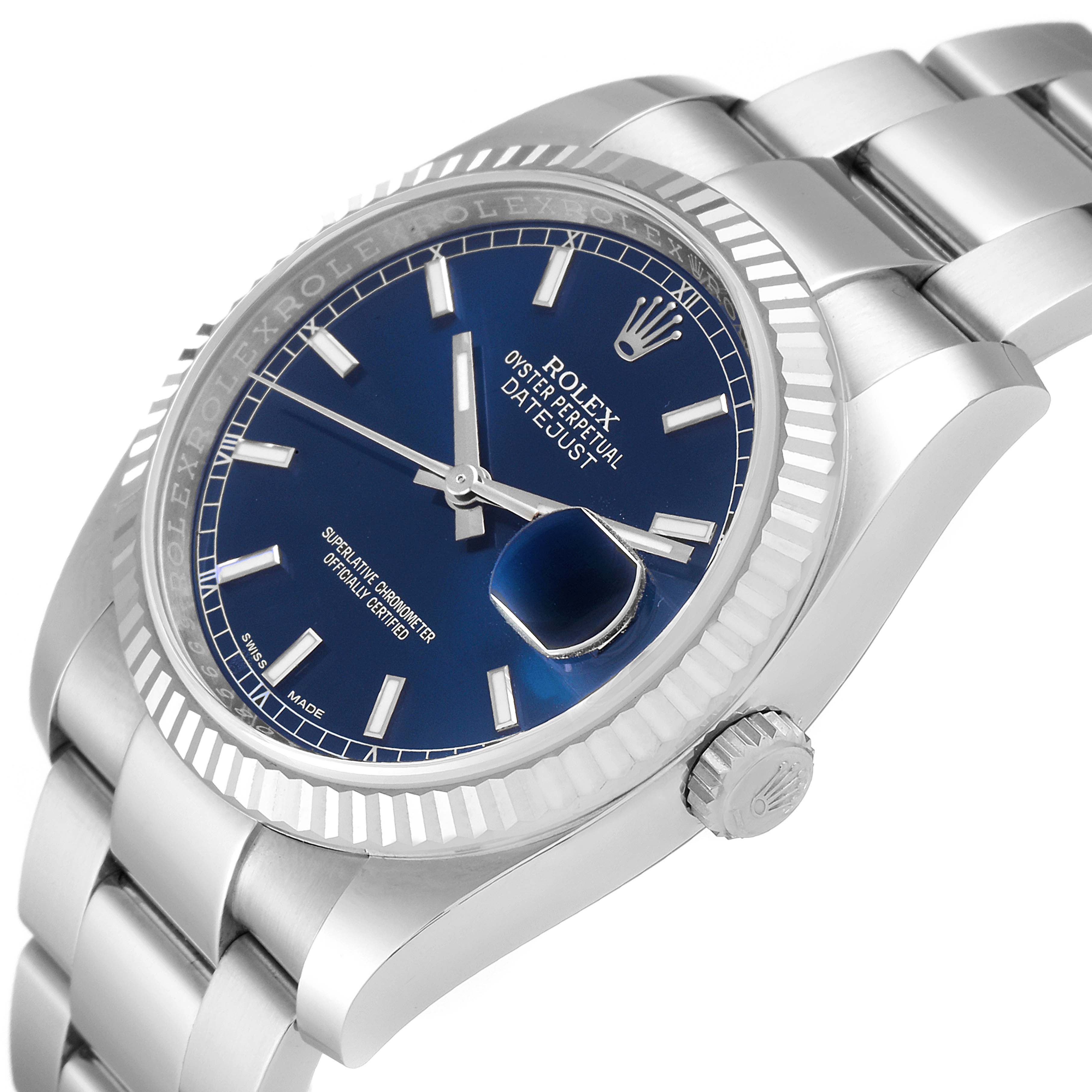 The image shows a Rolex Datejust 116234 Men's Stainless Steel Blue Dial 116234 Men's Stainless Steel Blue Dial watch angled to display the dial, crown, and fluted bezel.