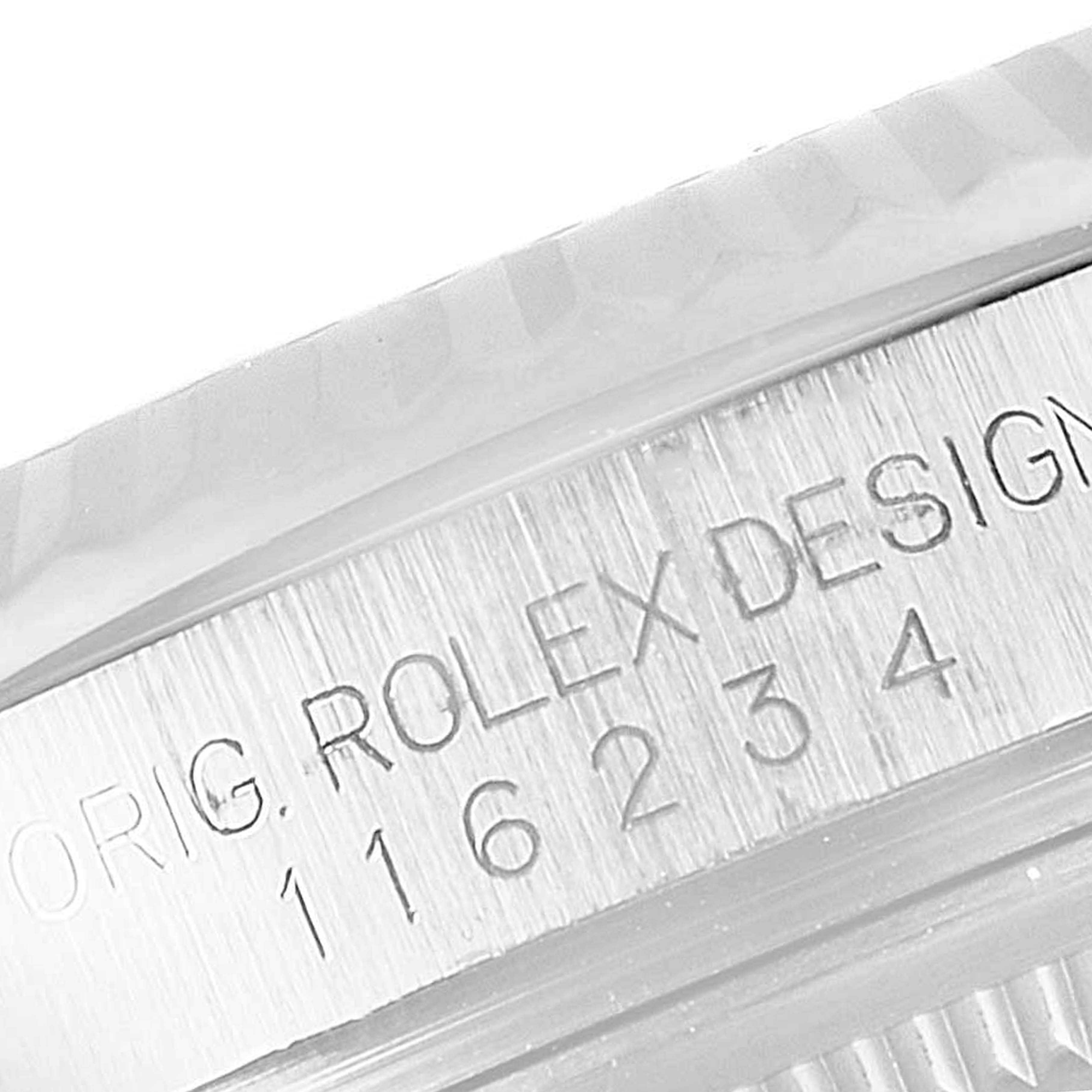 This is a close-up of the case side of a Rolex Datejust 116234 Men's Stainless Steel Blue Dial 116234 Men's Stainless Steel Blue Dial watch, showing the Rolex model number and "ORIG. ROLEX DESIGN" engraving.