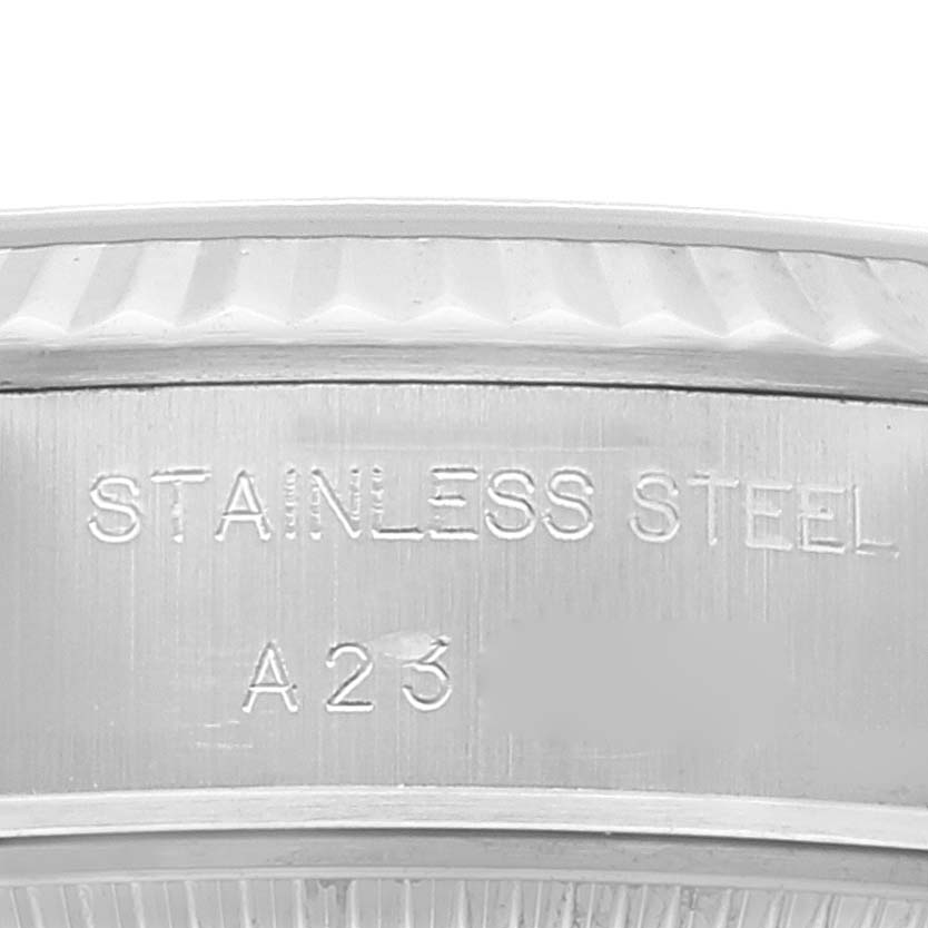 The image shows a close-up of the side of the stainless steel case of a Rolex Datejust 79174 Women's Stainless Steel Blue Dial 79174 Women's Stainless Steel Blue Dial watch.
