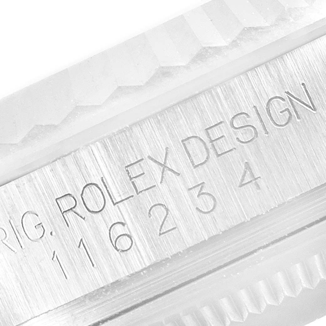 The image shows a close-up of the model number and fluted bezel of a Rolex Datejust 116234 Men's Stainless Steel Silver Dial 116234 Men's Stainless Steel Silver Dial watch.
