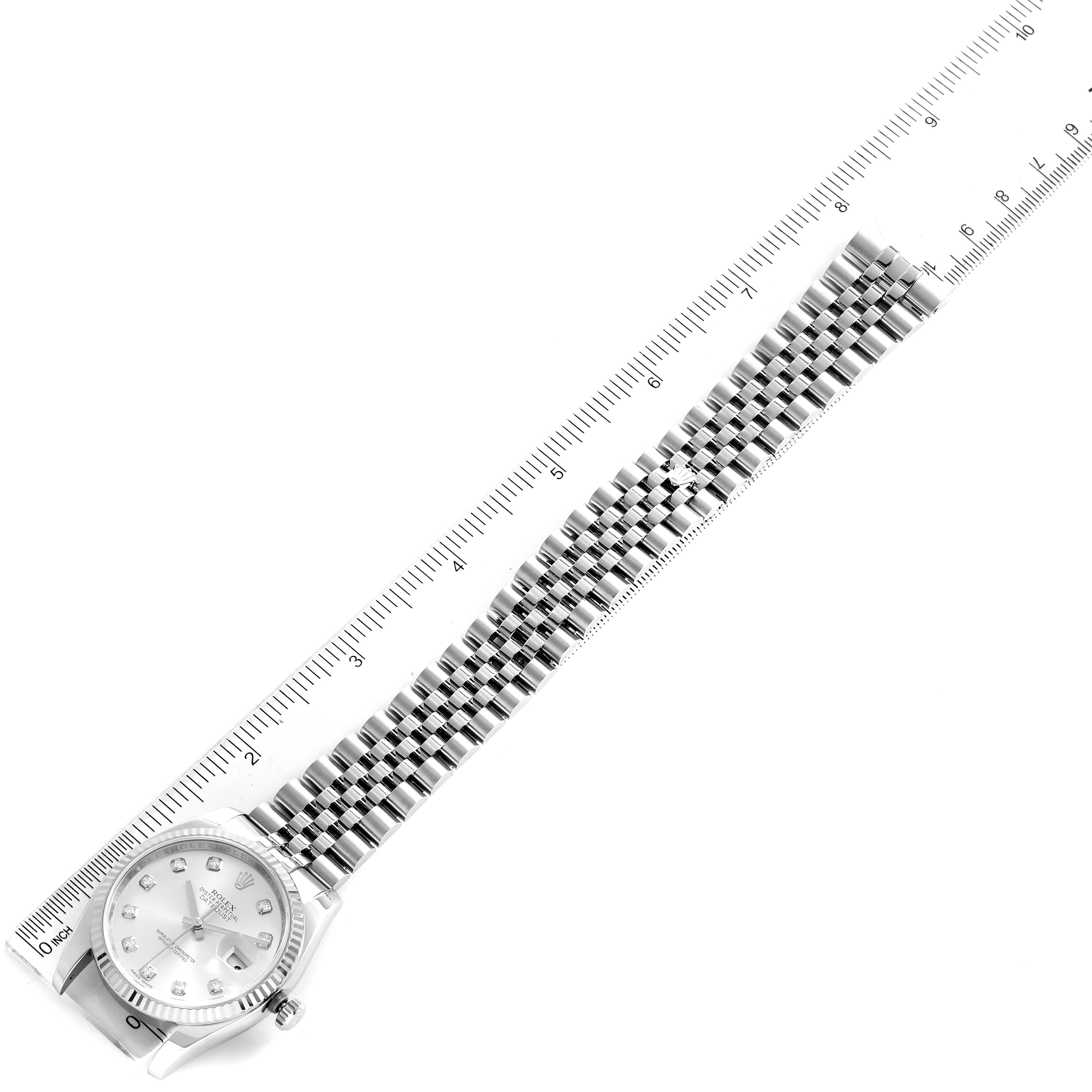 This image shows a Rolex Datejust 116234 Men's Stainless Steel Silver Dial 116234 Men's Stainless Steel Silver Dial watch laid flat with a measuring ruler, highlighting the watch face and full bracelet length.
