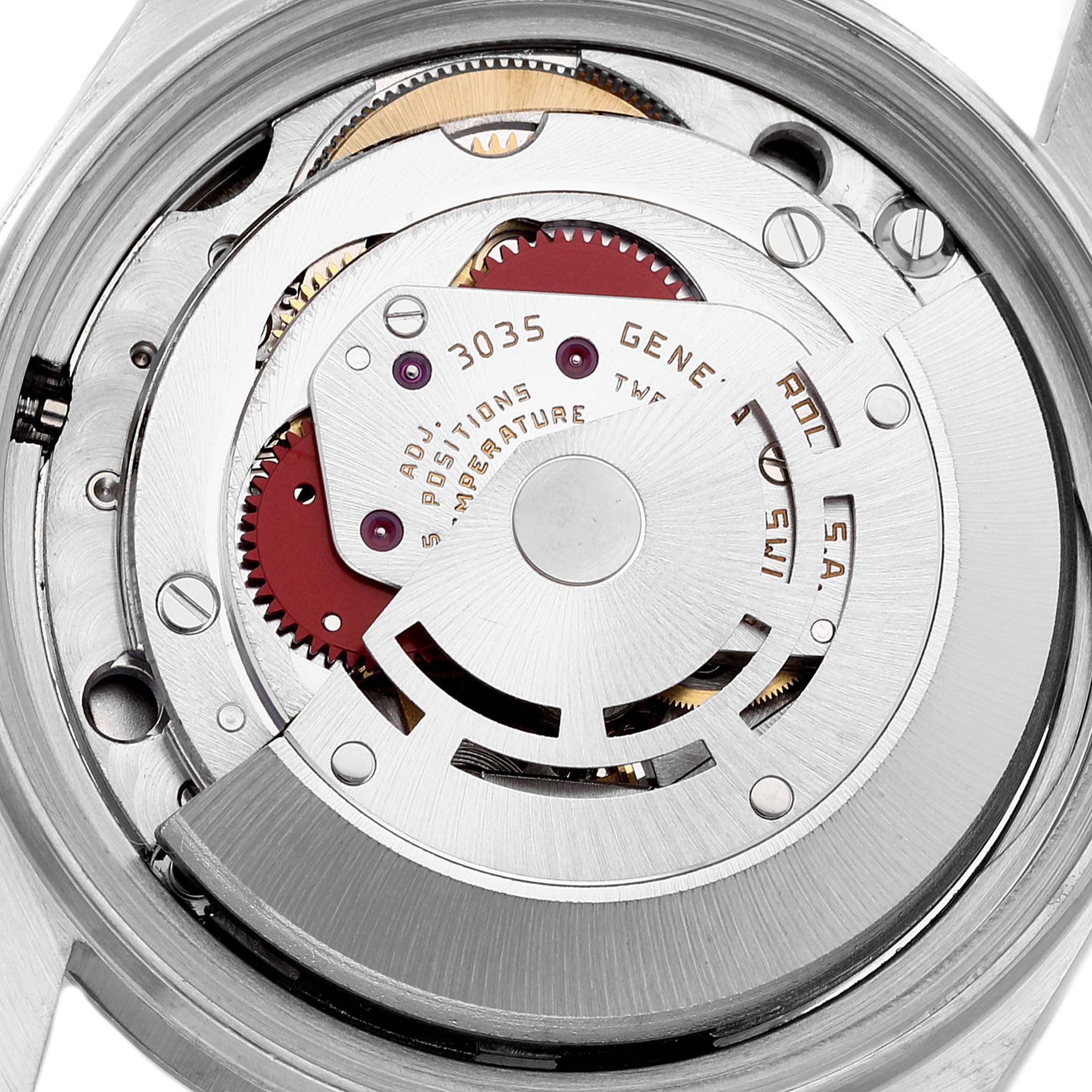 This image shows the Rolex Vintage Collection 16014 Men
s Stainless Steel Silver Dial 16014 Men
s Stainless Steel Silver Dial model
s movement from a back angle, revealing its intricate gears and components.