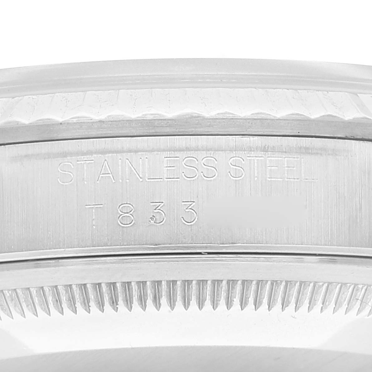 This image shows a close-up view of the side of a Rolex Datejust 16234 Men's Stainless Steel Silver Dial 16234 Men's Stainless Steel Silver Dial watch, highlighting the stainless steel engraving and serial number.