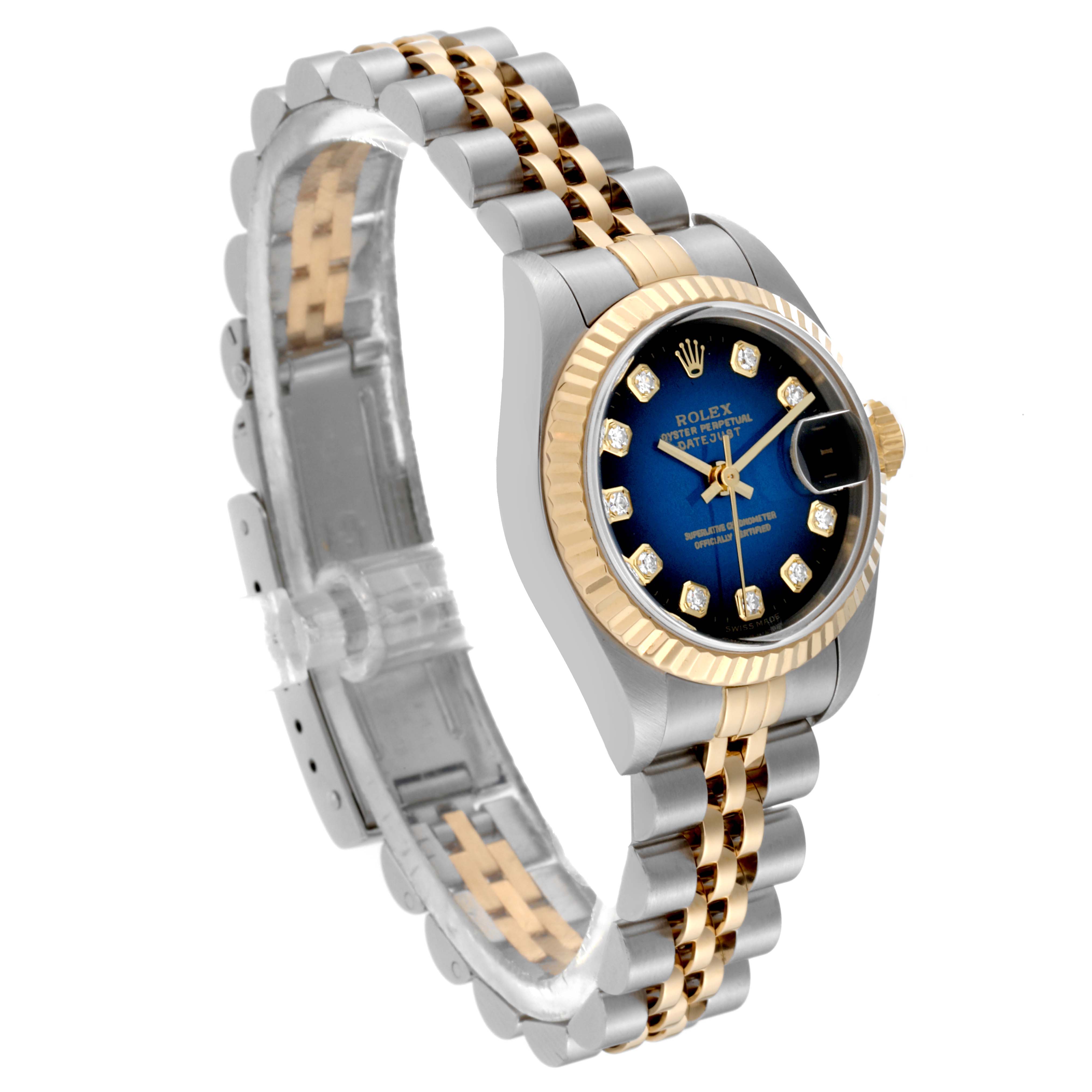 This Rolex Datejust 79173 Women's Steel and Gold (two tone) Blue Dial 79173 Women's Steel and Gold (two tone) Blue Dial model is shown from a three-quarter angle, displaying its blue dial, gold fluted bezel, and two-tone bracelet.