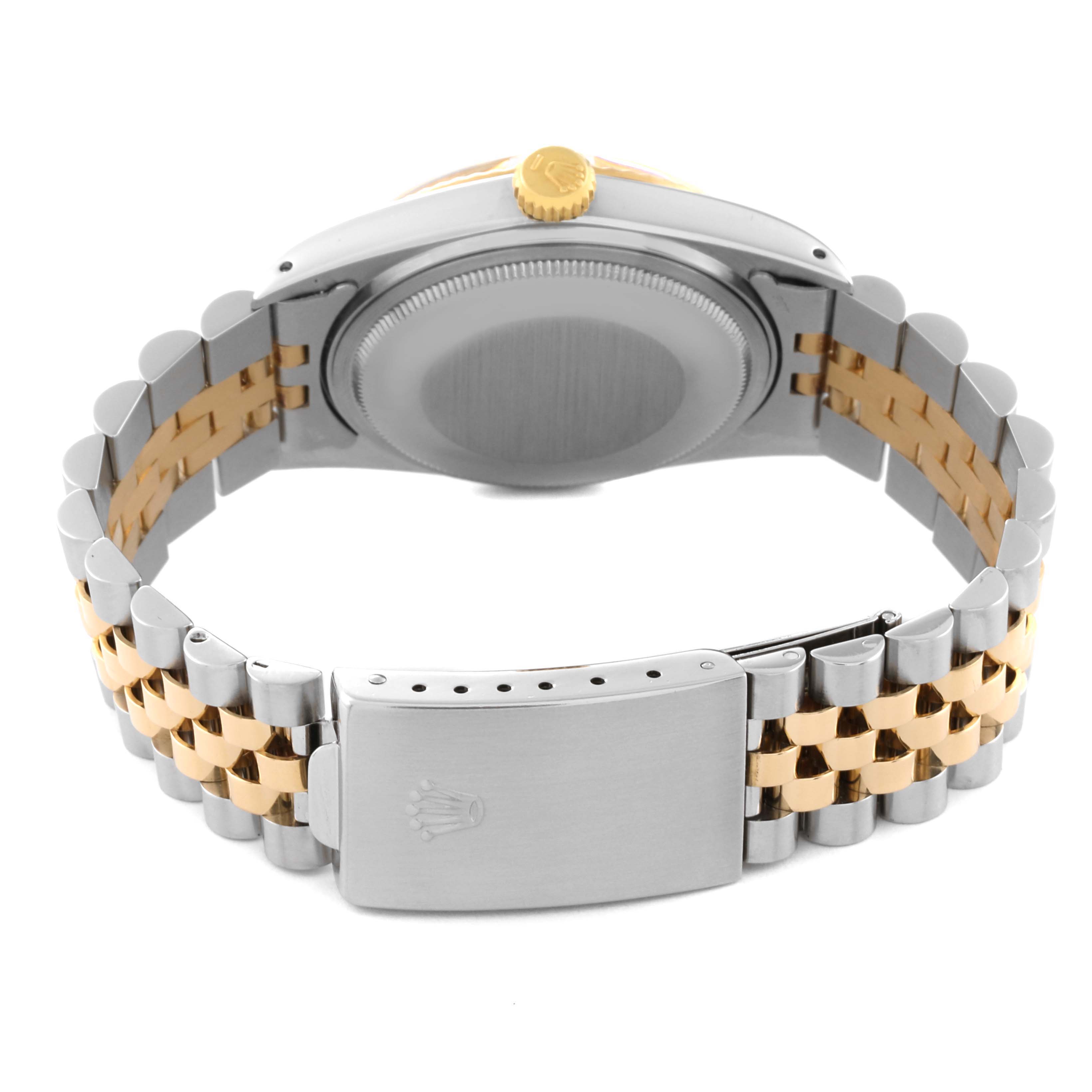 The image shows the rear view of the Rolex Vintage Collection 16013 Men's Steel and Gold (two tone) Champagne Dial 16013 Men's Steel and Gold (two tone) Champagne Dial watch with focus on its case back, crown, and two-tone Jubilee bracelet.