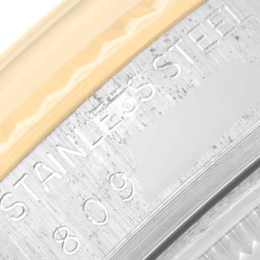 The image shows a close-up of the stainless steel case back of a Vintage Collection model Rolex watch.