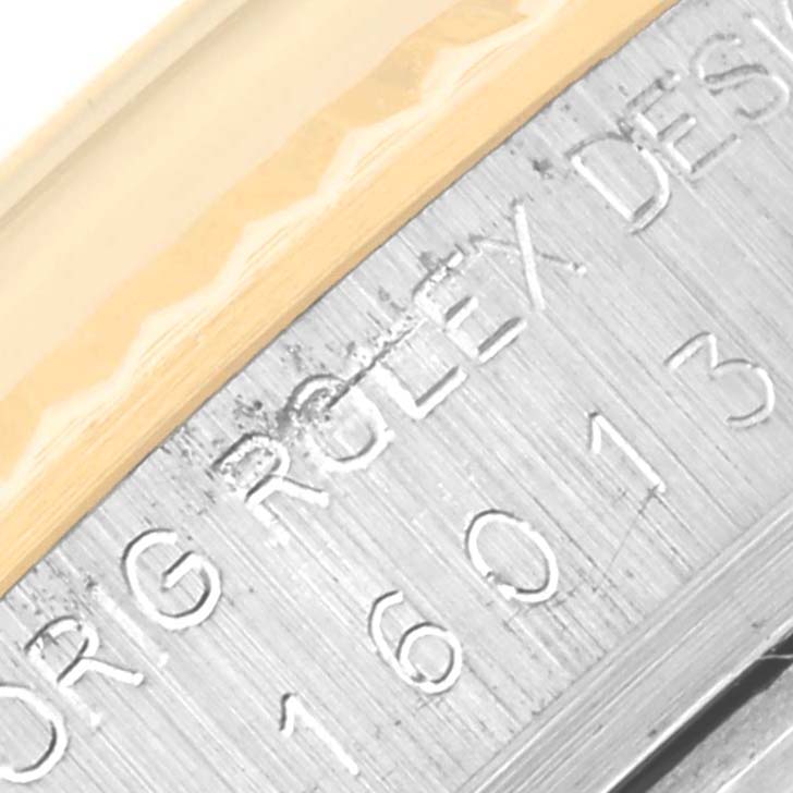 The image shows a close-up of the case and reference engraving on a Vintage Collection Rolex watch.