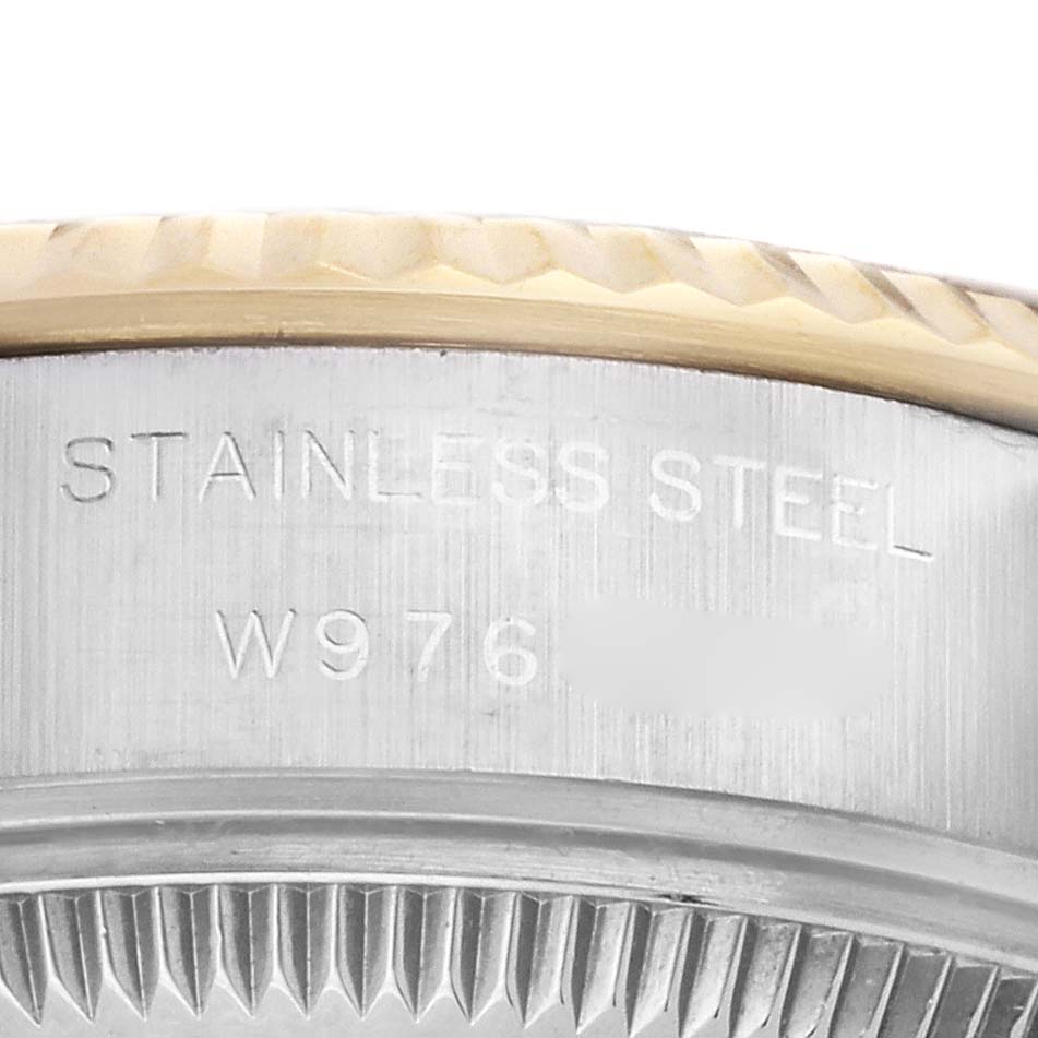 The image shows a close-up view of the side casing and bezel of a Rolex Datejust 69173 Women's Steel and Gold (two tone) Champagne Dial 69173 Women's Steel and Gold (two tone) Champagne Dial watch, featuring "Stainless Steel" marking and part of a serial number.