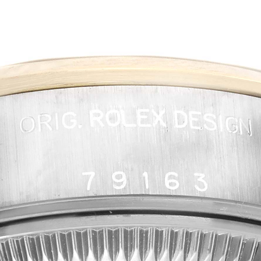 This image shows a close-up of the case side engraving on a Rolex Datejust 79163 Women's Steel and Gold (two tone) Grey Dial 79163 Women's Steel and Gold (two tone) Grey Dial, revealing the model number and "ORIG. ROLEX DESIGN".