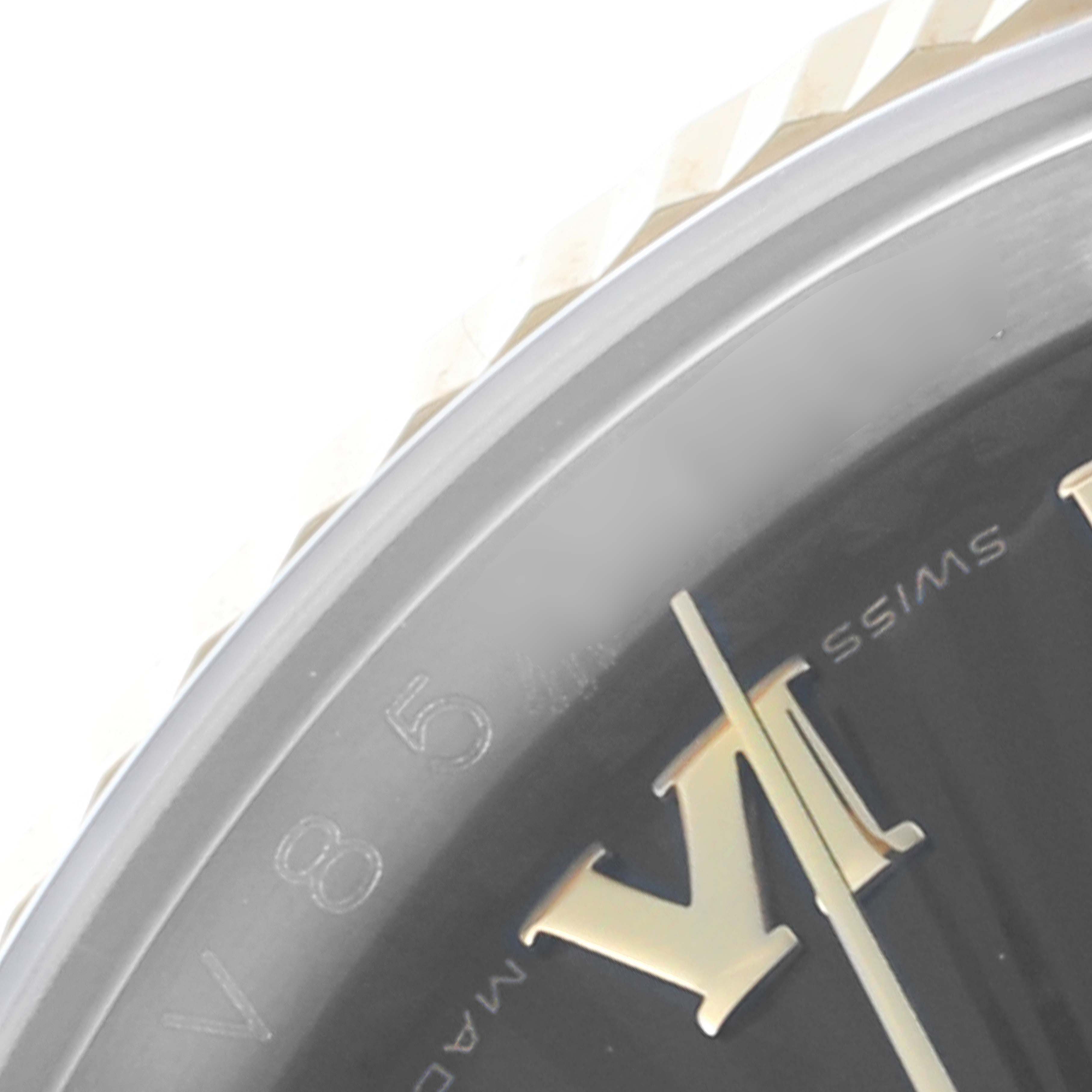 The image shows a close-up of the Rolex Datejust 116233 Men's Steel and Gold (two tone) Black Dial 116233 Men's Steel and Gold (two tone) Black Dial watch dial, focusing on the bezel, Roman numeral, and part of the second hand.
