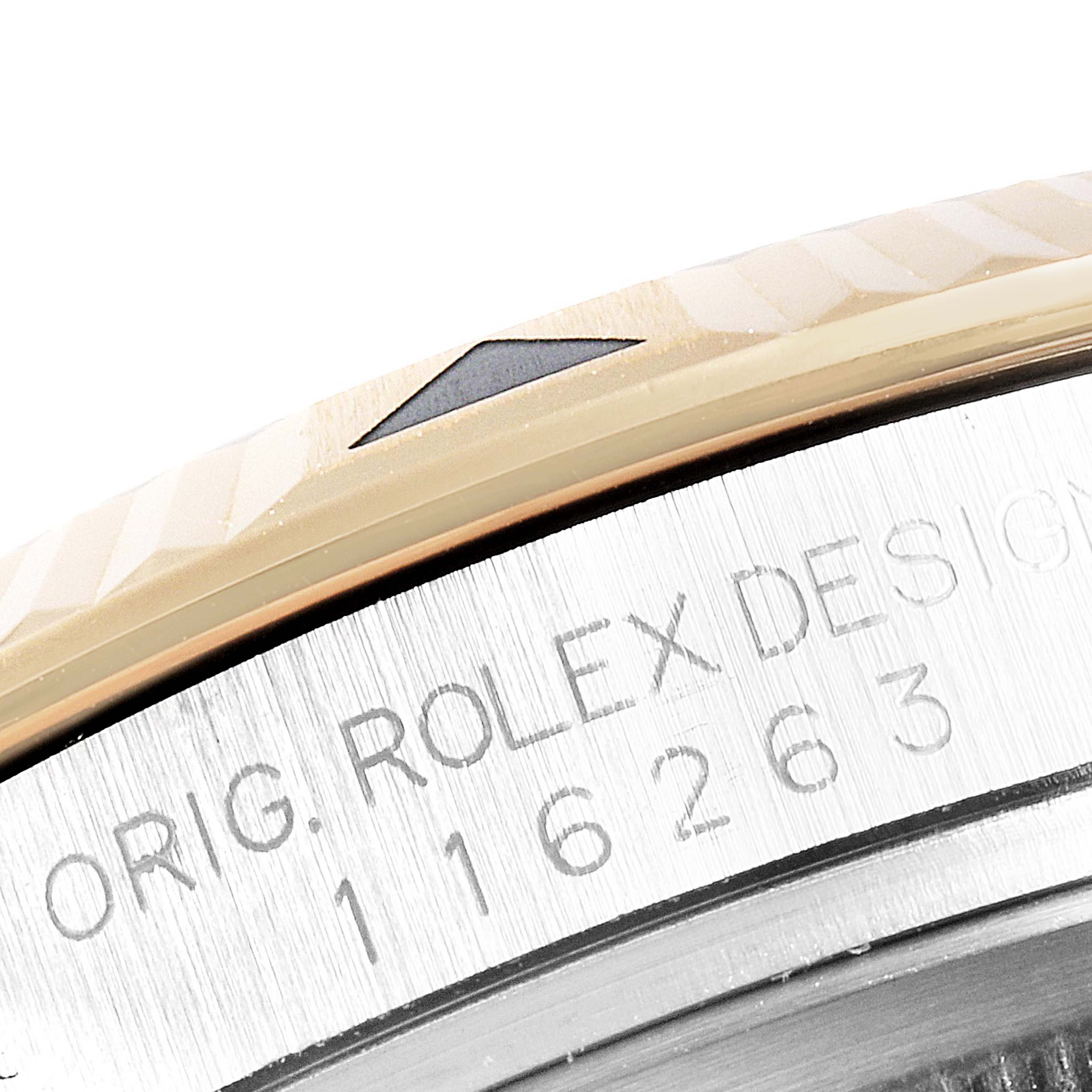 The image shows a close-up of the bezel and part of the casing with engravings on a Rolex Turn-o-Graph 116263 Men
s Steel and Gold (two tone) White Dial 116263 Men
s Steel and Gold (two tone) White Dial watch.