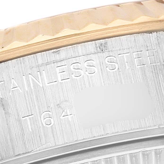 The image shows a close-up of the engraved bezel and case back of a Rolex Datejust 69173 Women's Steel and Gold (two tone) White Dial 69173 Women's Steel and Gold (two tone) White Dial watch.