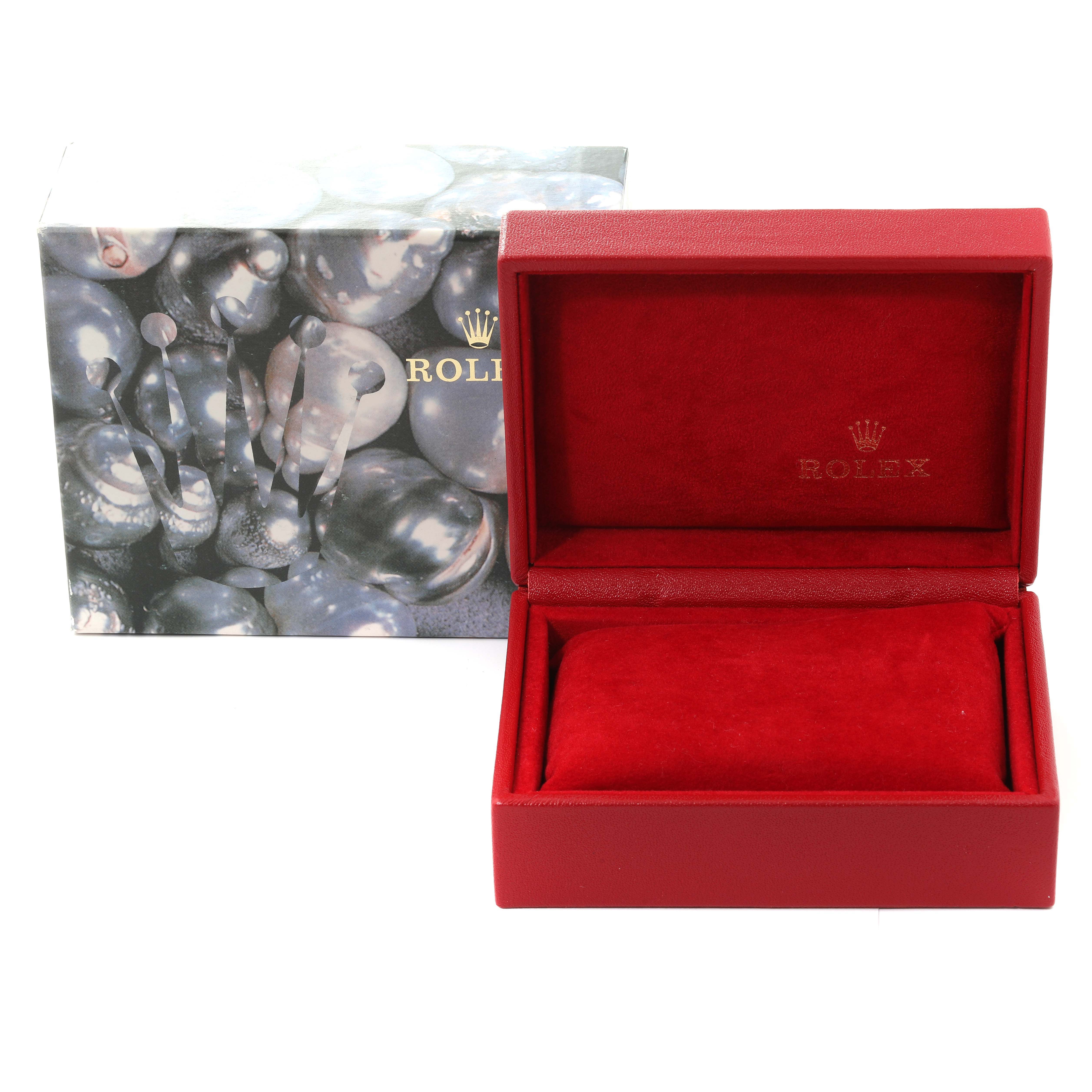 The image shows an open red Rolex watch box with a cushion and an outer box featuring a Rolex logo.