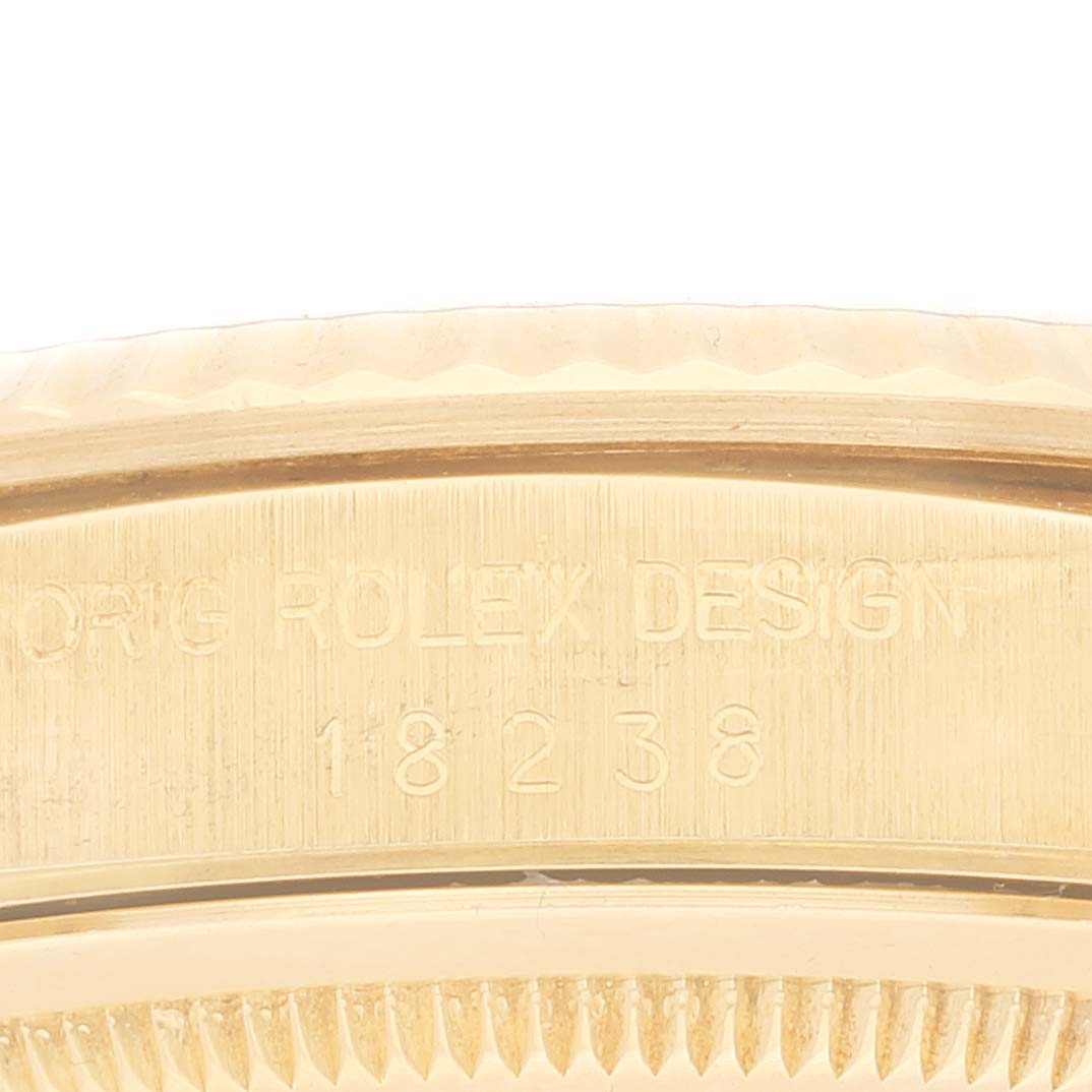 This close-up image shows the side case engraving of a Rolex President 18238 Men
s Yellow Gold Champagne Dial 18238 Men
s Yellow Gold Champagne Dial model, highlighting the model number and design details.