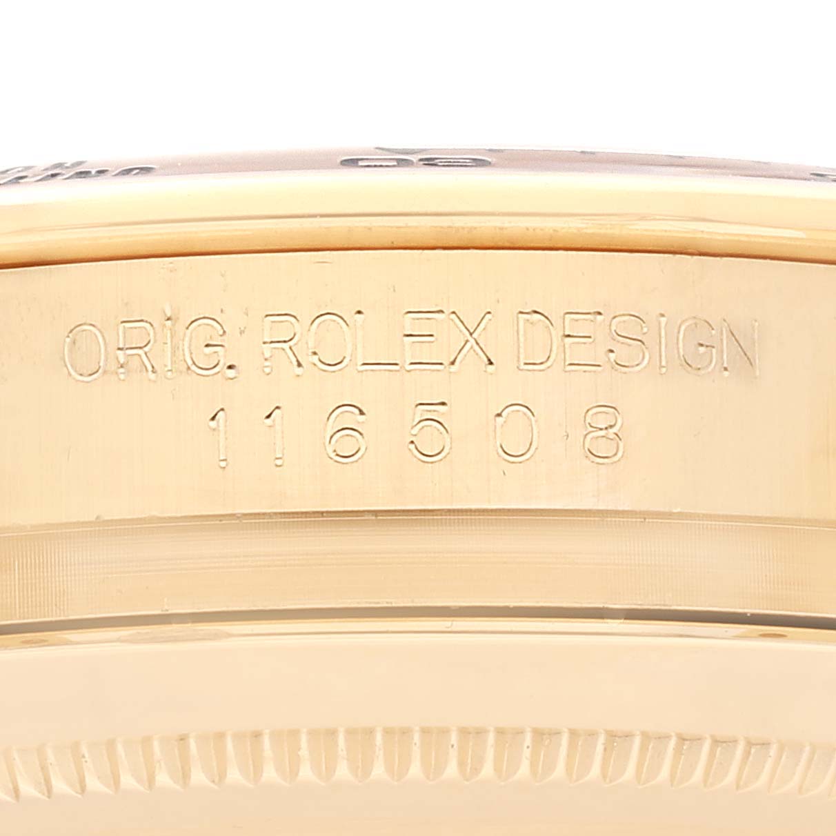 This image shows the side of a Rolex Daytona 116508 Men's Yellow Gold Green Dial 116508 Men's Yellow Gold Green Dial watch, featuring the "ORIG. ROLEX DESIGN" engraving and model number 116508.