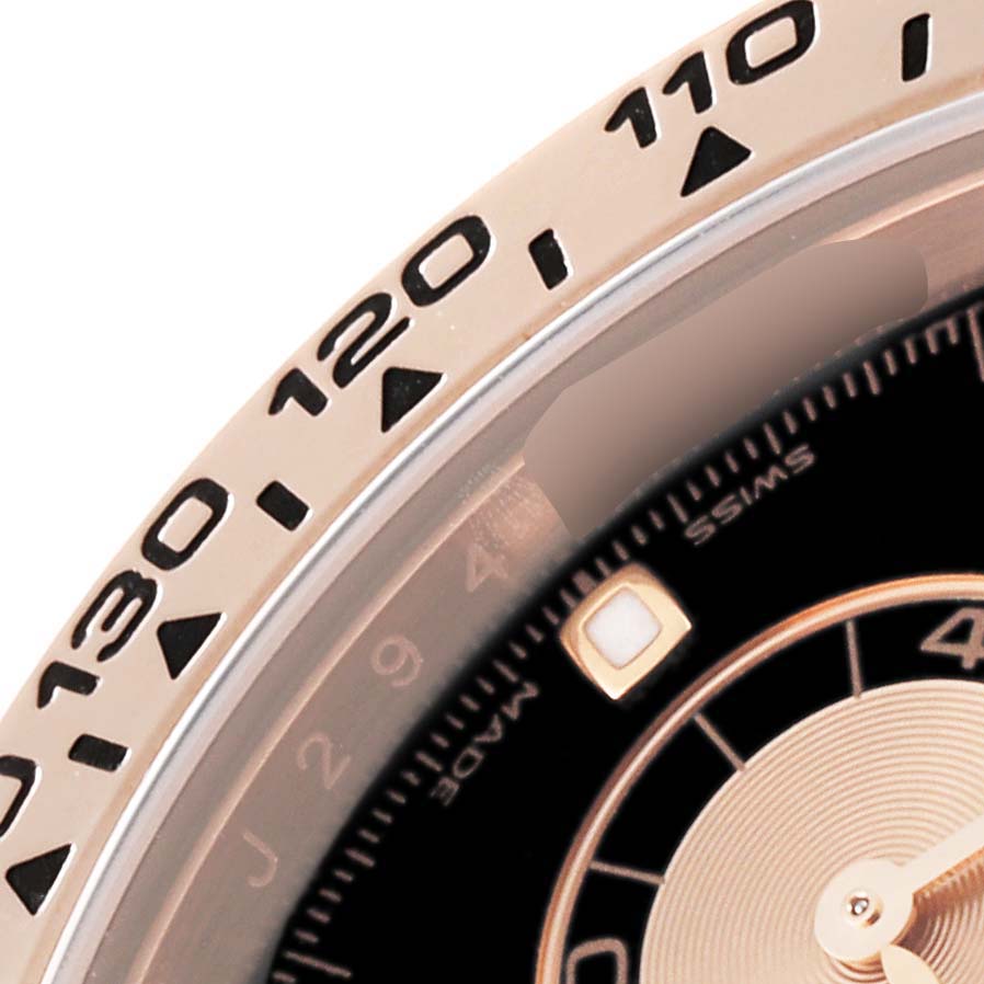 The image shows a close-up of the bezel and dial of a Rolex Daytona 116505 Men's Rose Gold Black Dial 116505 Men's Rose Gold Black Dial watch, with part of the tachymeter scale visible.