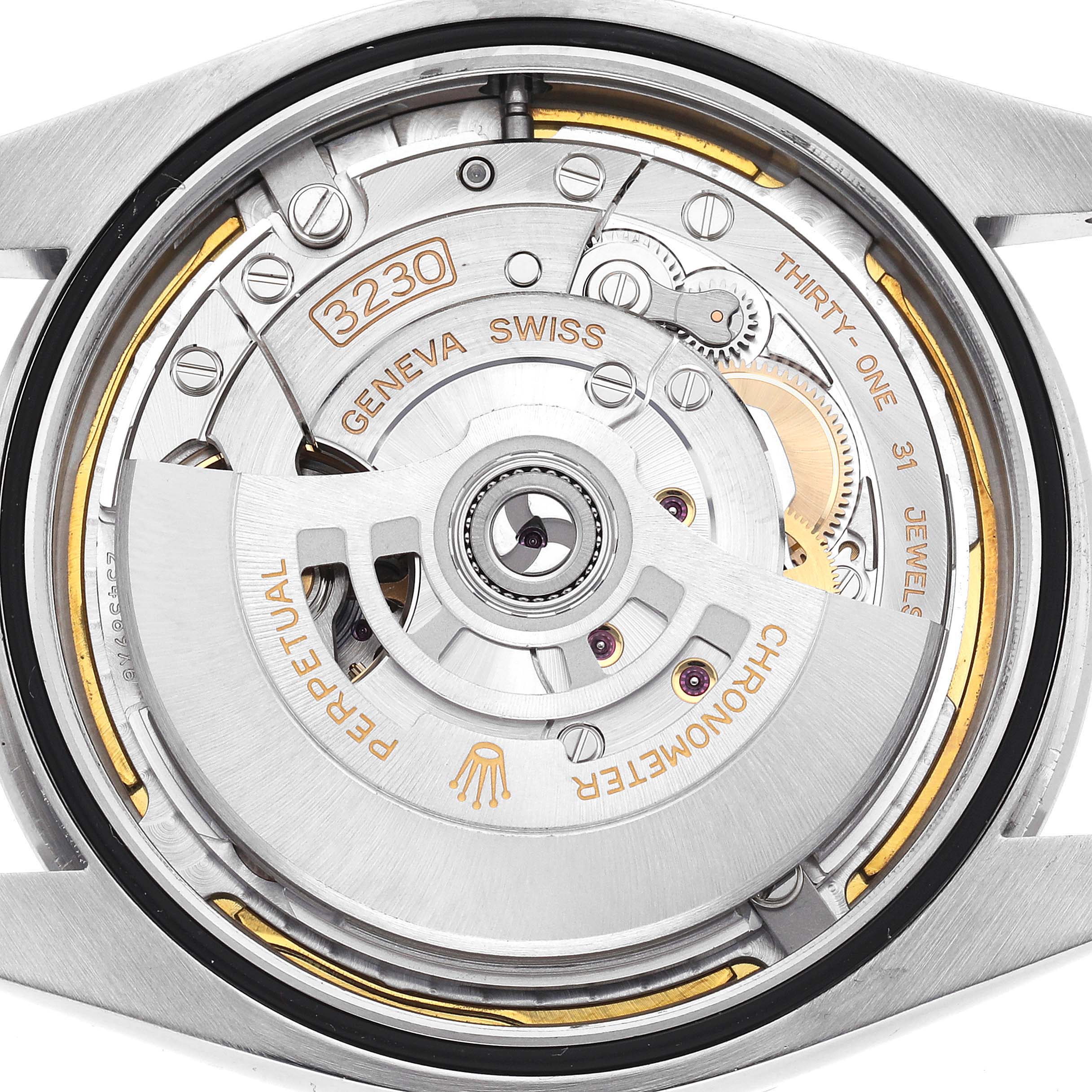 The image shows the movement of a Rolex Explorer, model 224270, focusing on the rotor and intricate internal mechanics from a rear angle.