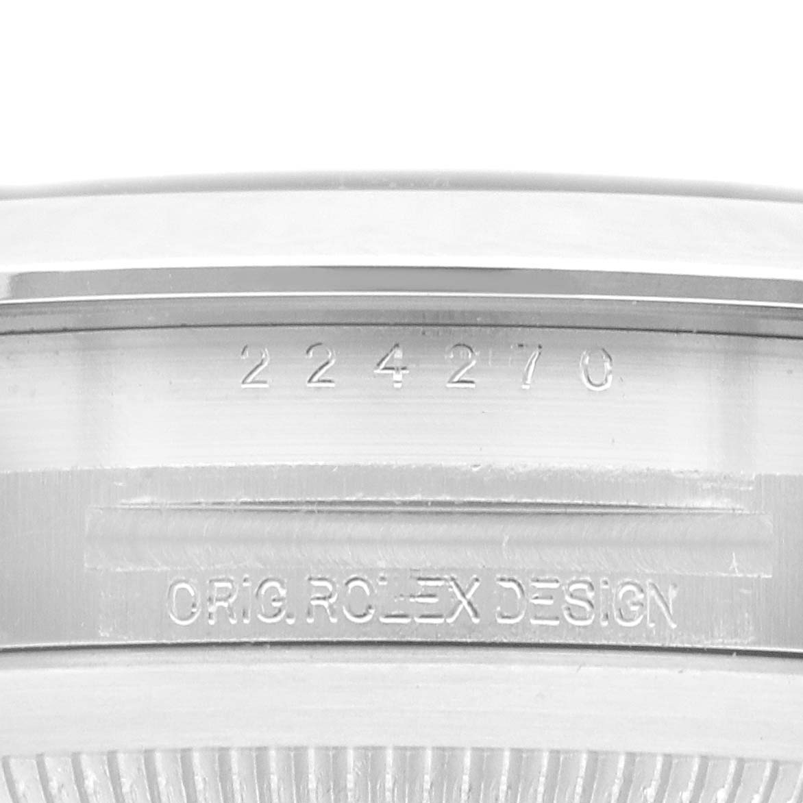 The image shows the engraved side of a Rolex Explorer watch, model number 224270, highlighting the "Orig. Rolex Design" inscription.