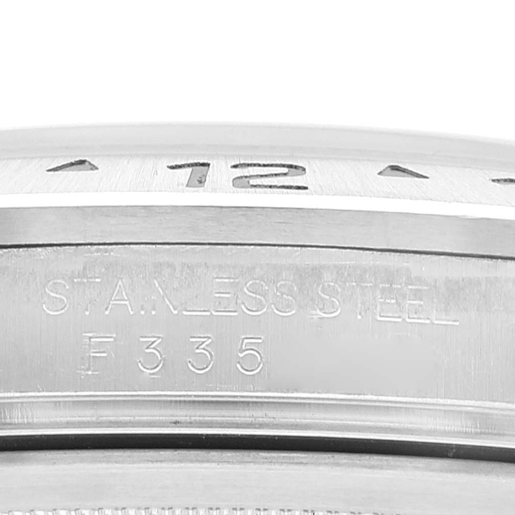 The image shows a close-up of the bezel and case side of the stainless steel Rolex Explorer 16570 Men's Stainless Steel White Dial 16570 Men's Stainless Steel White Dial watch, including part of the bezel engraving.