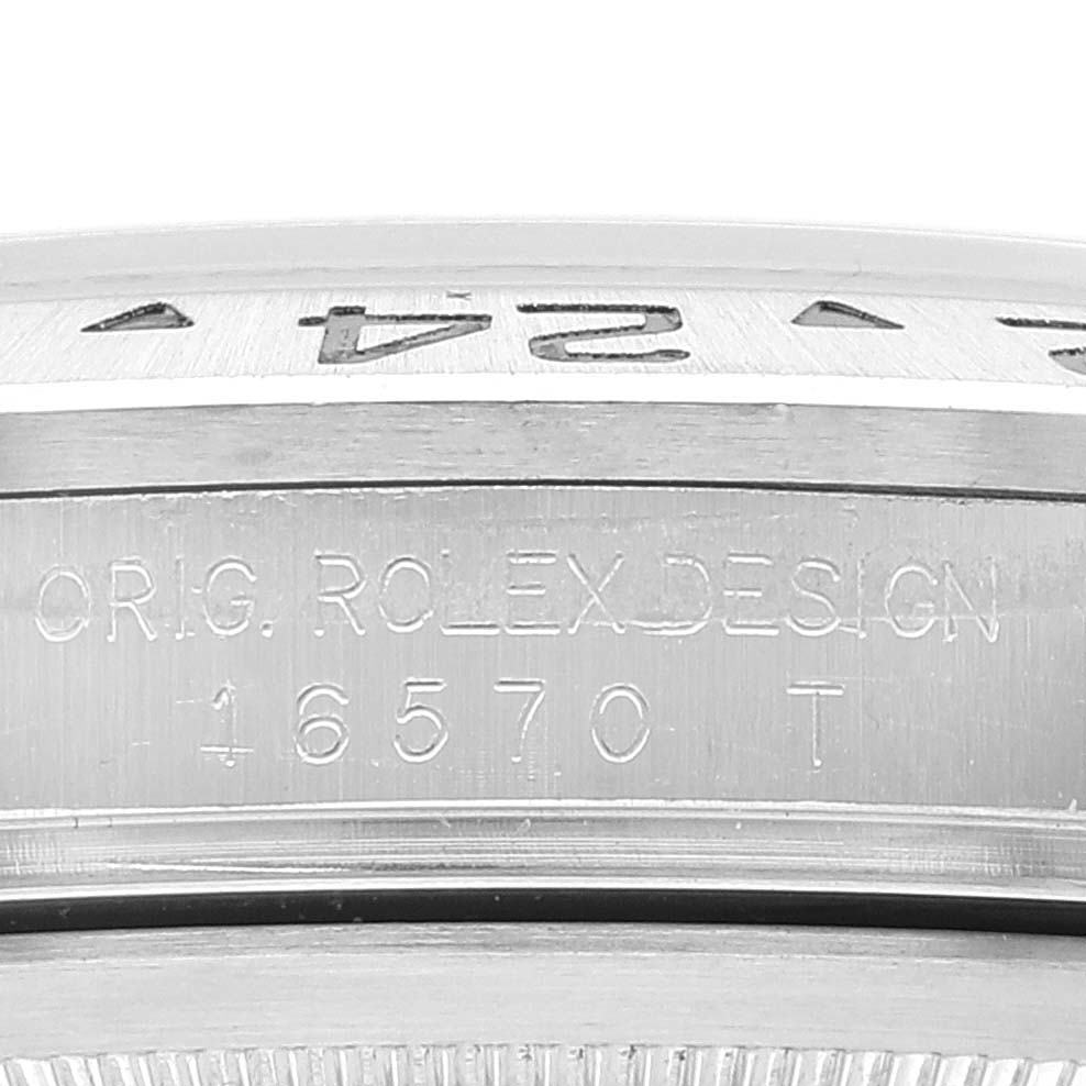 This close-up image shows the engraved bezel and case edge of the Rolex Explorer 16570 Men's Stainless Steel White Dial 16570 Men's Stainless Steel White Dial model 16570.