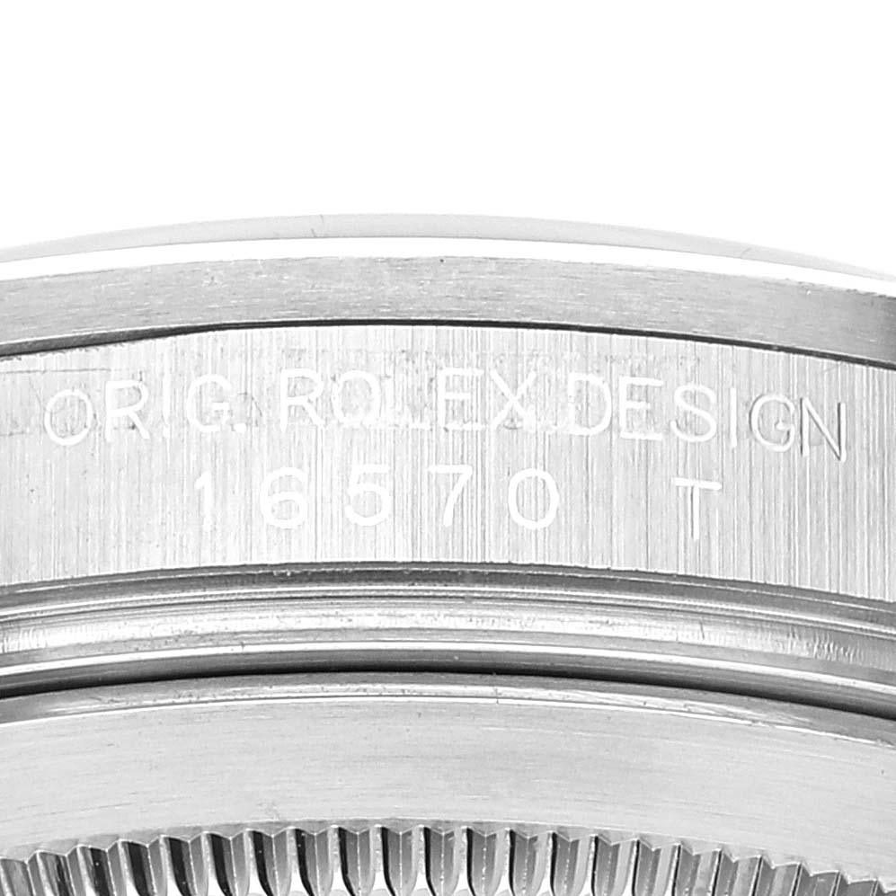 The image shows a close-up of the case side and bezel of a Rolex Explorer 16570 Men's Stainless Steel Black Dial 16570 Men's Stainless Steel Black Dial with the reference number 16570 engraved.