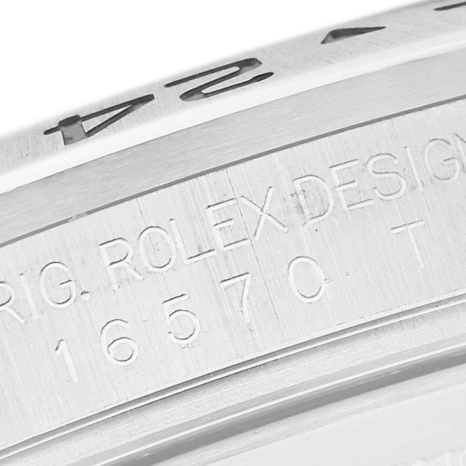 The image shows a close-up of the case side and bezel with engravings on a Rolex Explorer 16570 Men
s Stainless Steel Black Dial 16570 Men
s Stainless Steel Black Dial watch.