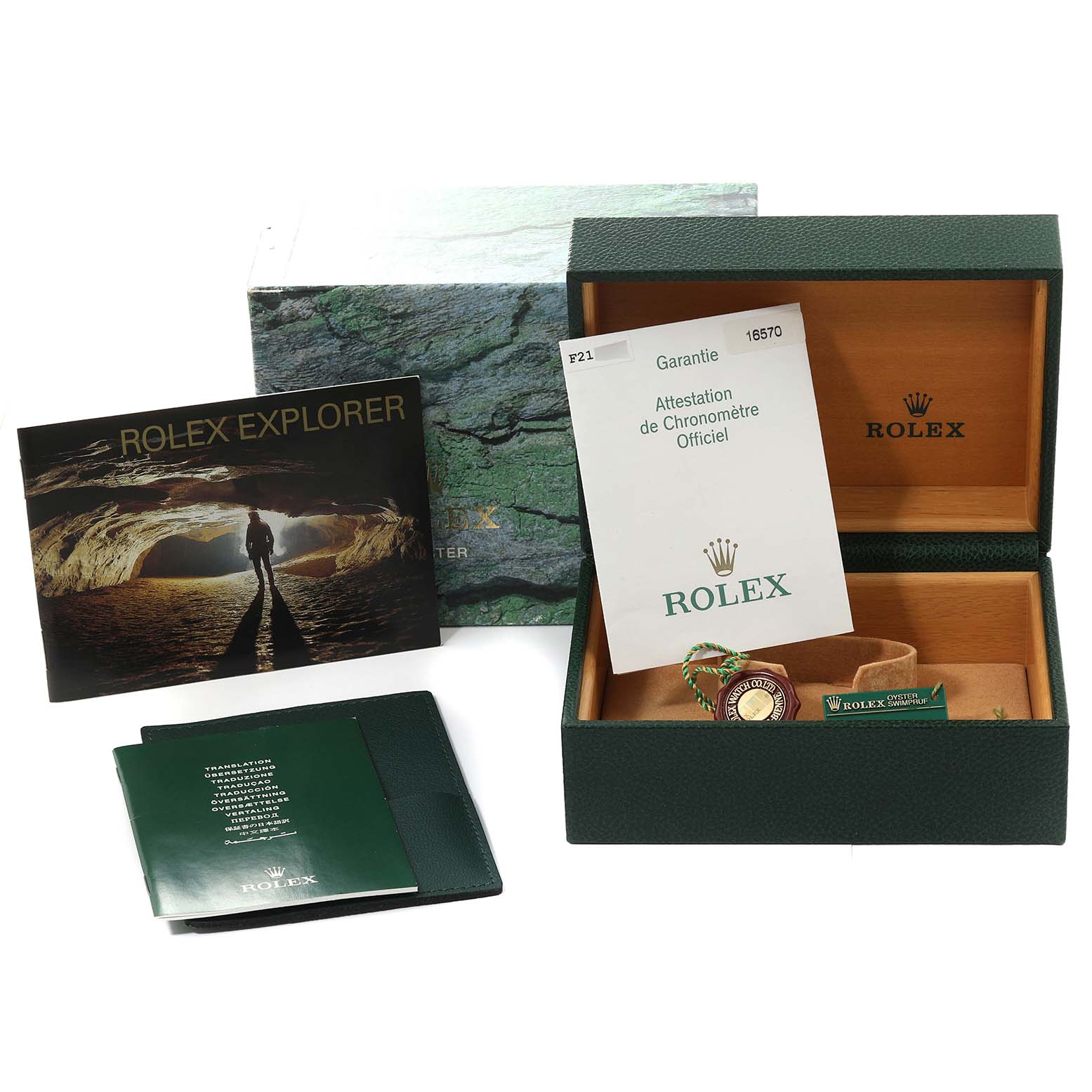 The image shows the packaging and accessories for the Rolex Explorer 16570 Men
s Stainless Steel Black Dial 16570 Men
s Stainless Steel Black Dial model, including box, papers, tags, and booklets.