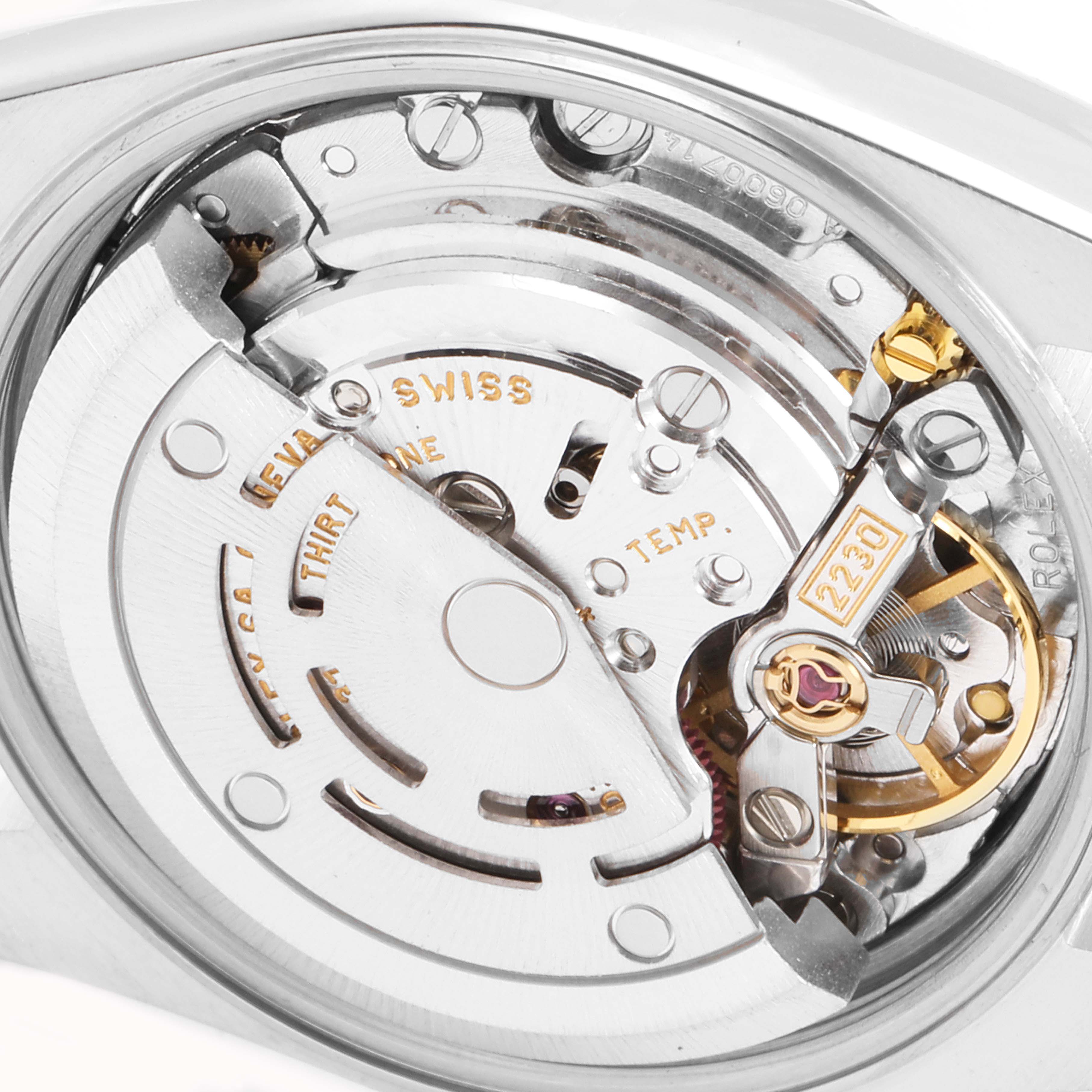 The image shows the Rolex Oyster Perpetual 76080 Women
s Stainless Steel Blue Dial 76080 Women
s Stainless Steel Blue Dial watch
s movement mechanism from a close-up angle.