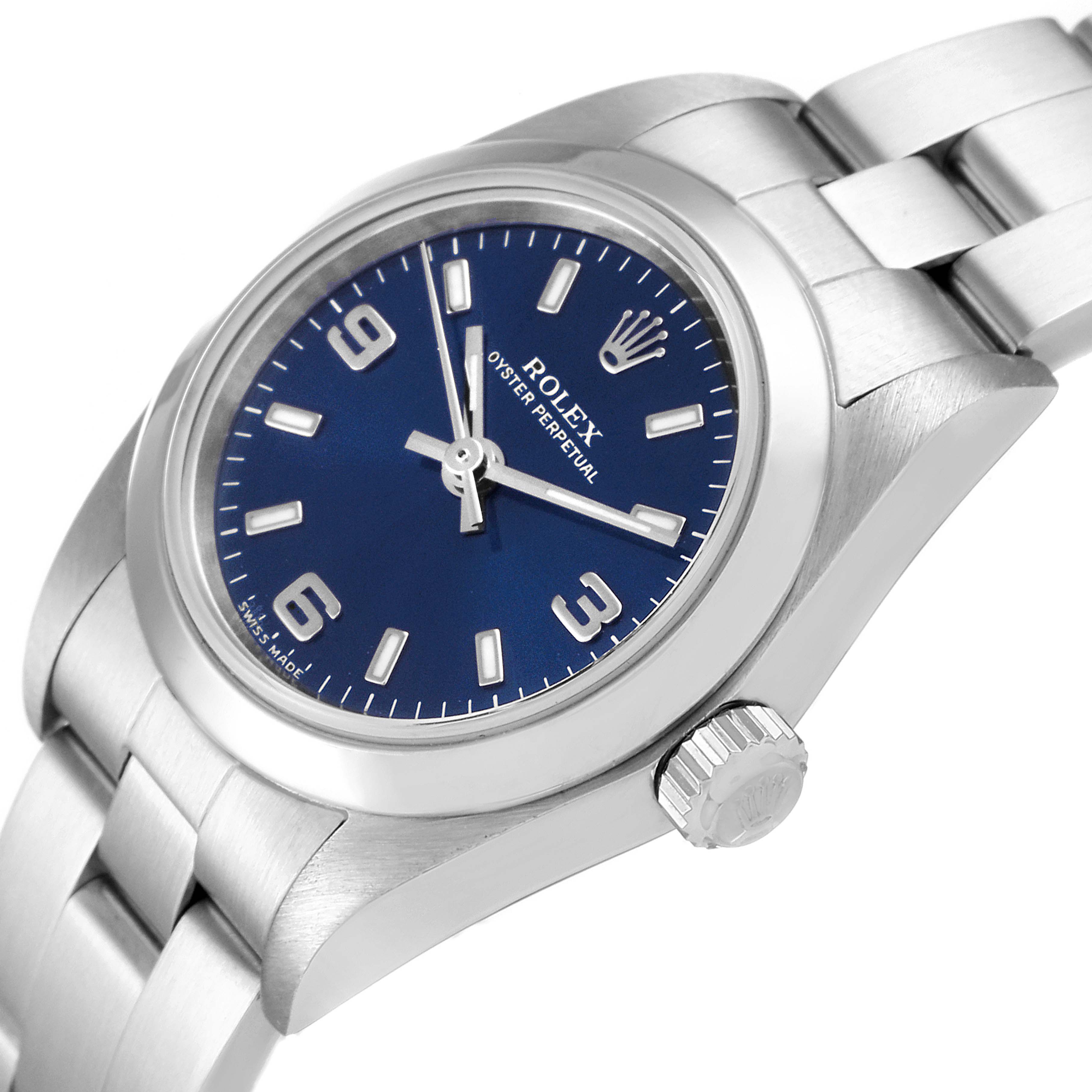 The image shows a close-up angled view of a Rolex Oyster Perpetual 76080 Women
s Stainless Steel Blue Dial 76080 Women
s Stainless Steel Blue Dial watch, highlighting the dial, crown, and part of the bracelet.
