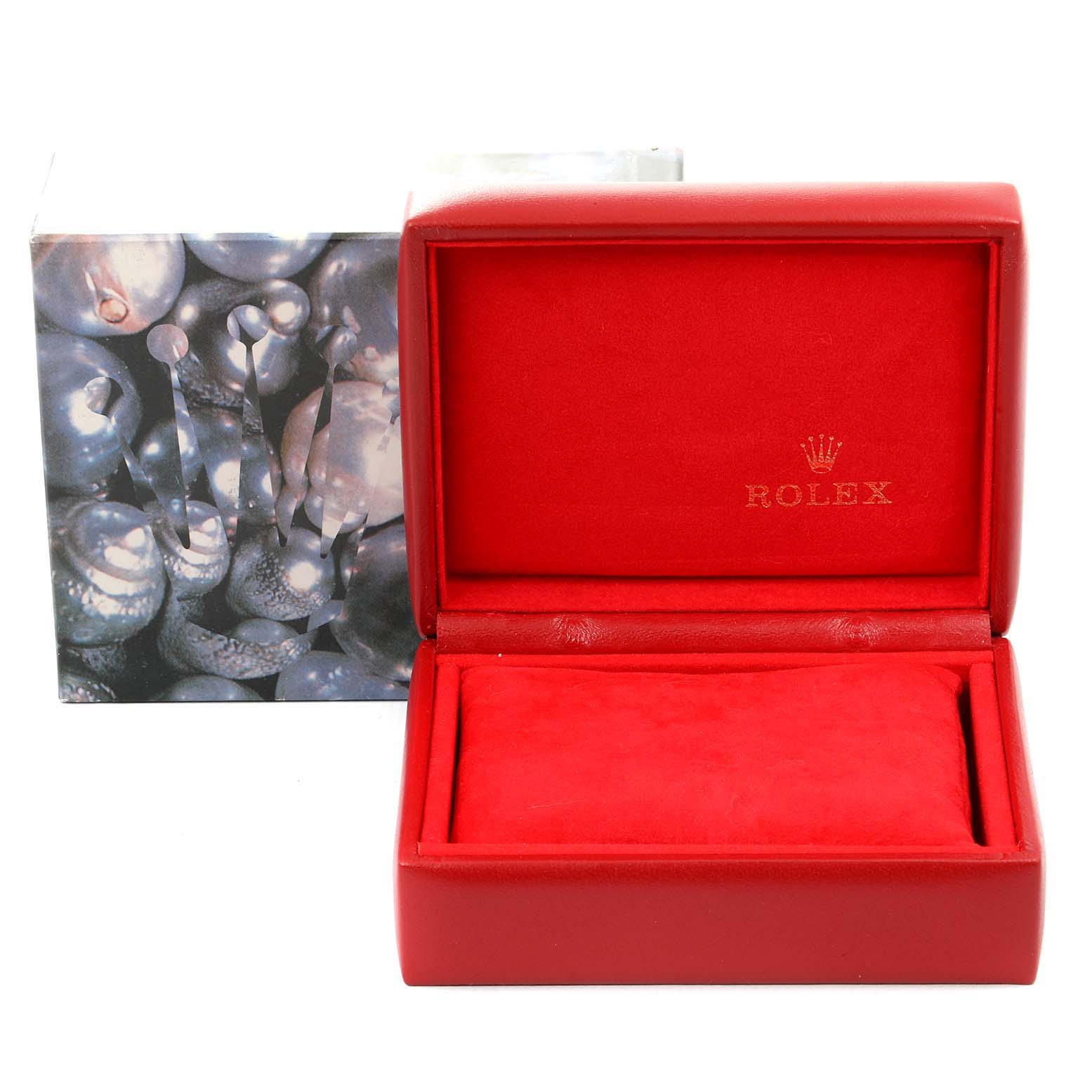 The image shows a red Rolex Oyster Perpetual 67180 Women's Stainless Steel Black Dial 67180 Women's Stainless Steel Black Dial watch box, open, with the brand logo inside and an outer box in the background.