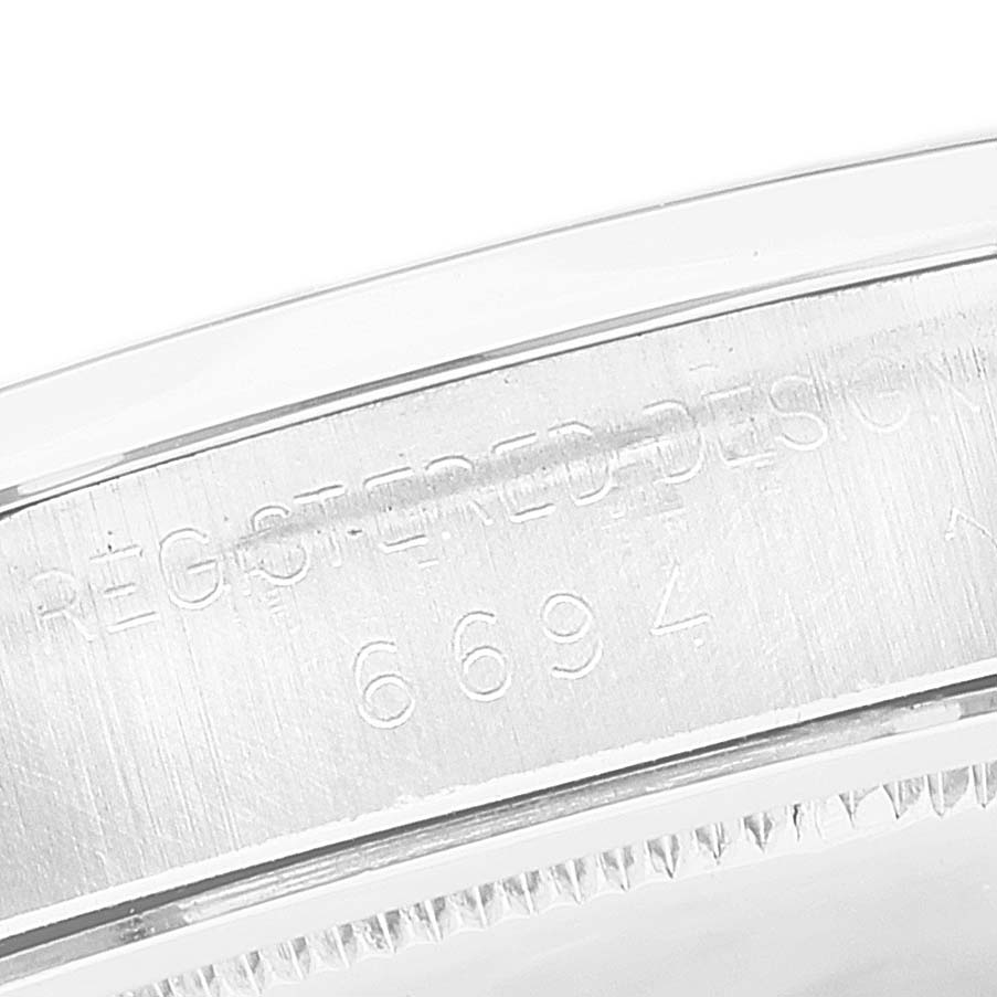 This image shows a close-up of the engraving on the case of the Rolex Vintage Collection 6694 Men
s Stainless Steel Silver Dial 6694 Men
s Stainless Steel Silver Dial model watch.