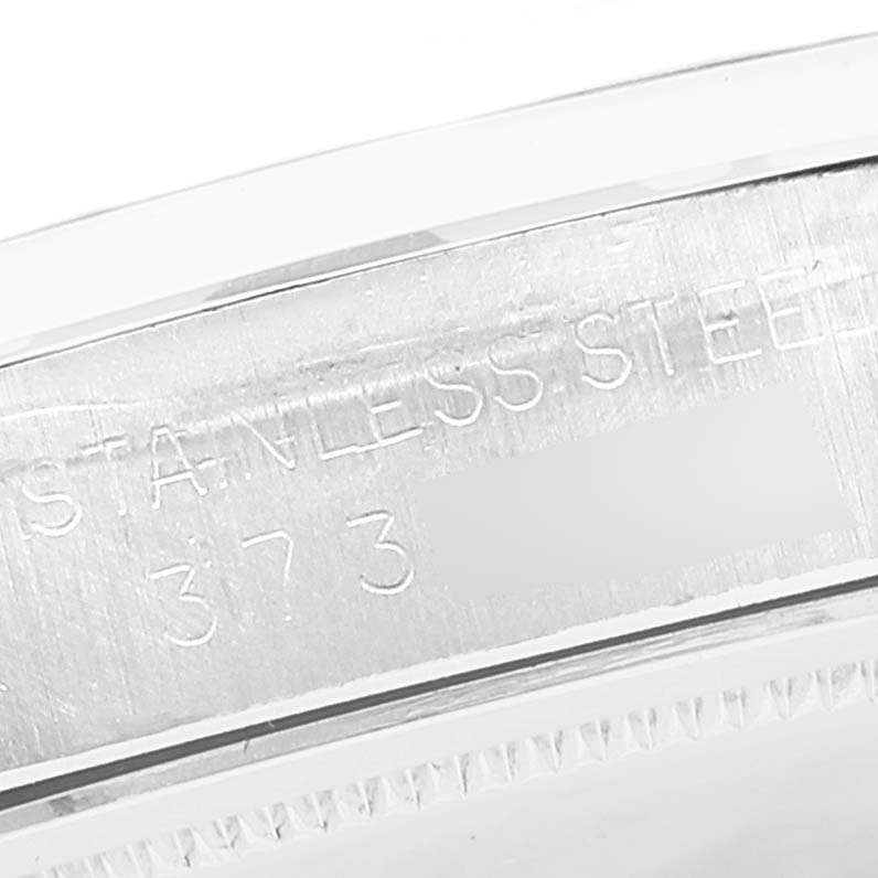 This is a close-up of the stainless steel case back of the Rolex Vintage Collection 6694 Men
s Stainless Steel Silver Dial 6694 Men
s Stainless Steel Silver Dial watch, displaying part of its engraved serial number.